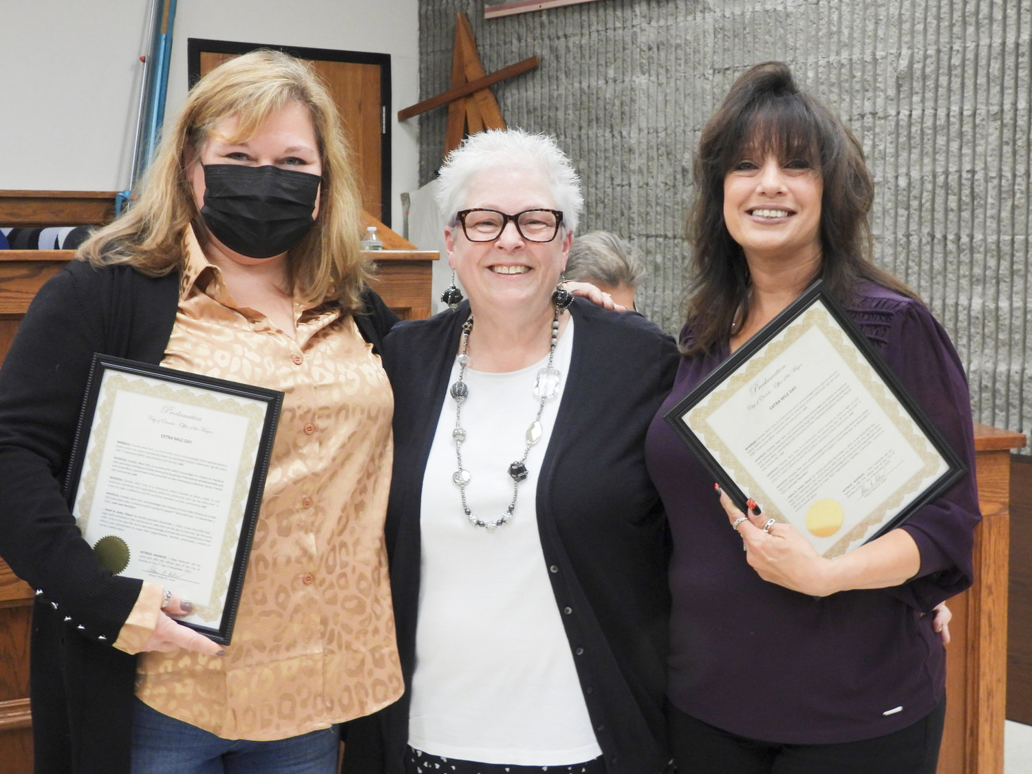 Mayor Helen Acker, center, presents the Extra Mile Day proclamations to Stacy Jones, left, of Oneida Office Supply and Lori Seef of Bella Vita at the Tuesday, Nov. 1 Common Council meeting. The Extra Mile proclamation is given to individuals and organizations that go above and beyond for the city of Oneida