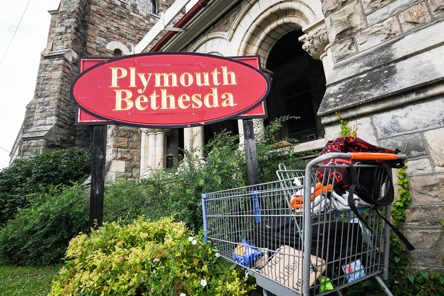 A shopping cart is left in front of Cornerstone Plymouth Bethesda Church in Utica. The church helps aid the homeless community as much as possible.