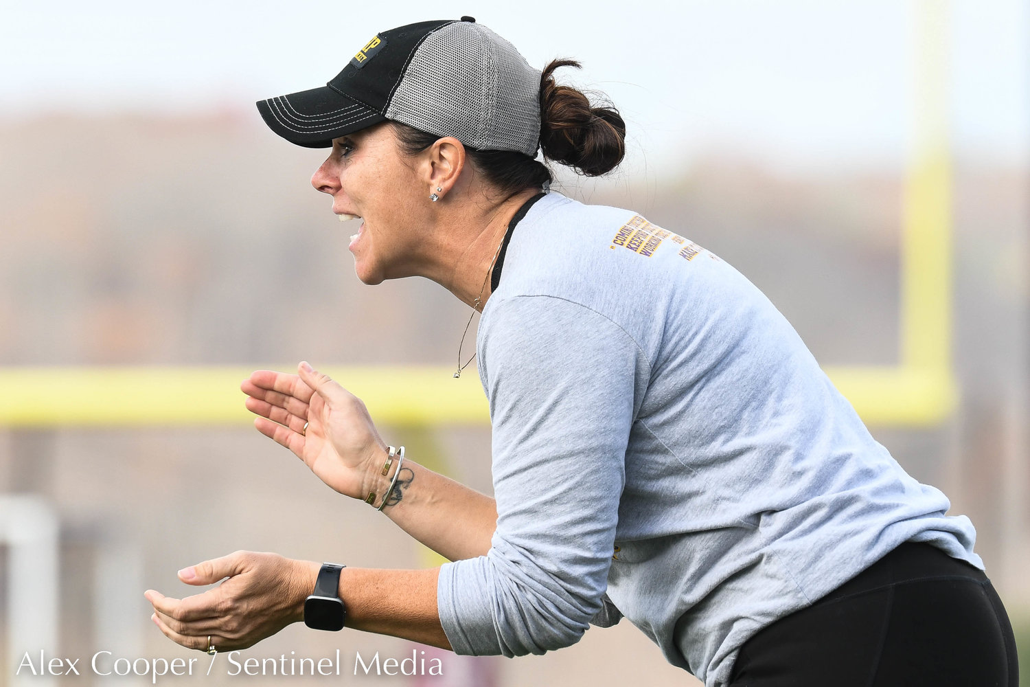 Holland Patent head coach Renee Morrison encourages players from the sidelines during the Class B field hockey state regional against Vestal on Saturday at Sidney High School. Vestal won 2-1.