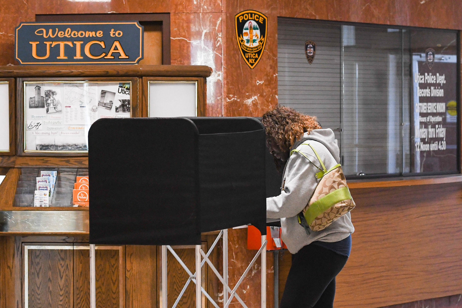 A woman fills out her ballot at Utica City Hall on Tuesday, Nov. 8. Oneida County election commissioners reported a busy day at the polls, with some 4,500 to 4,700 voters each hour going to cast their ballots across the county.