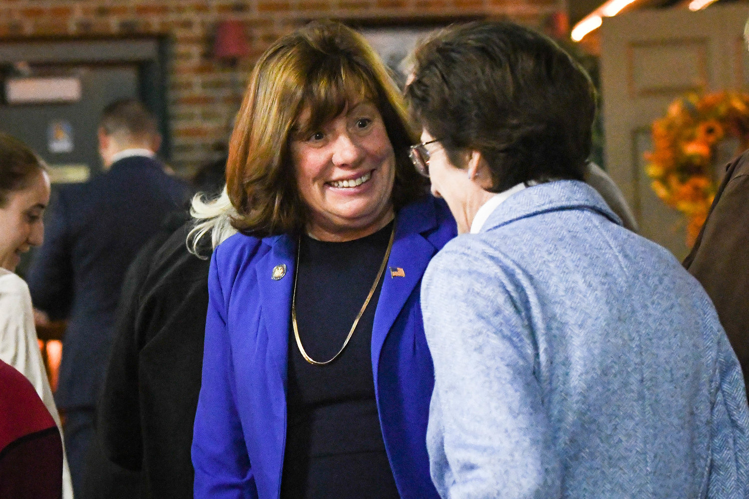 Assemblywoman Marianne Buttenschon  talks with supporters during an election party hosted on Tuesday night at Aqua Vino Restaurant in Utica.