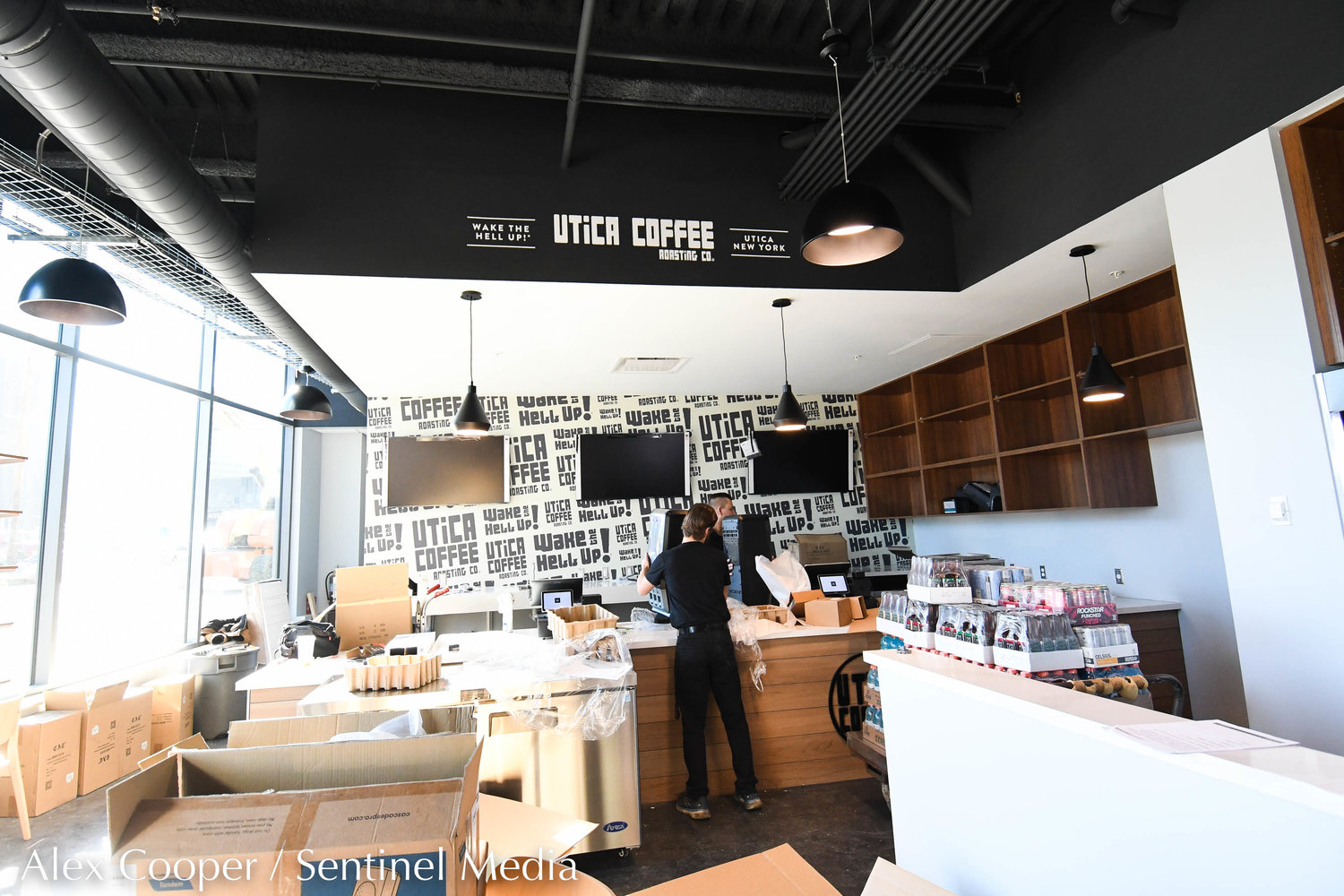 Workers set up a Utica Coffee Roasting Co. cafe inside the Nexus Center on Wednesday, Nov. 9 in Utica. The inaugural game will take place tonight between the NCDC Utica Jr. Comets and the Mercer Chiefs. The first tournament will take place from Nov. 11 to 13 for youth hockey teams.