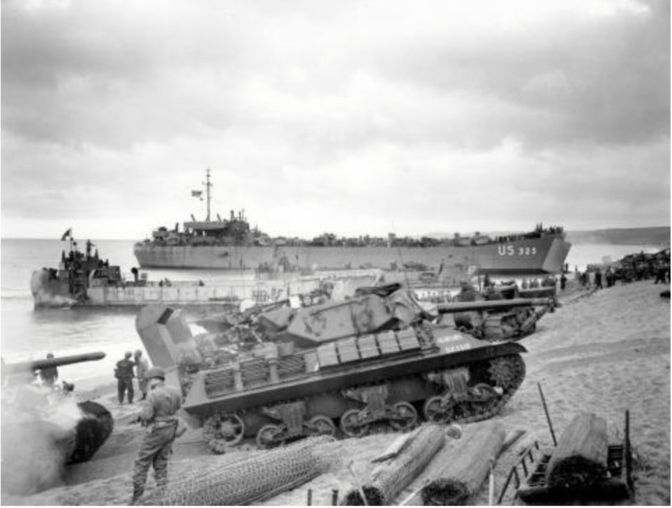 Tanks roll onto the beach in England as part of Exercise Tiger, a training exercise for the D-Day Invasion in World War II.