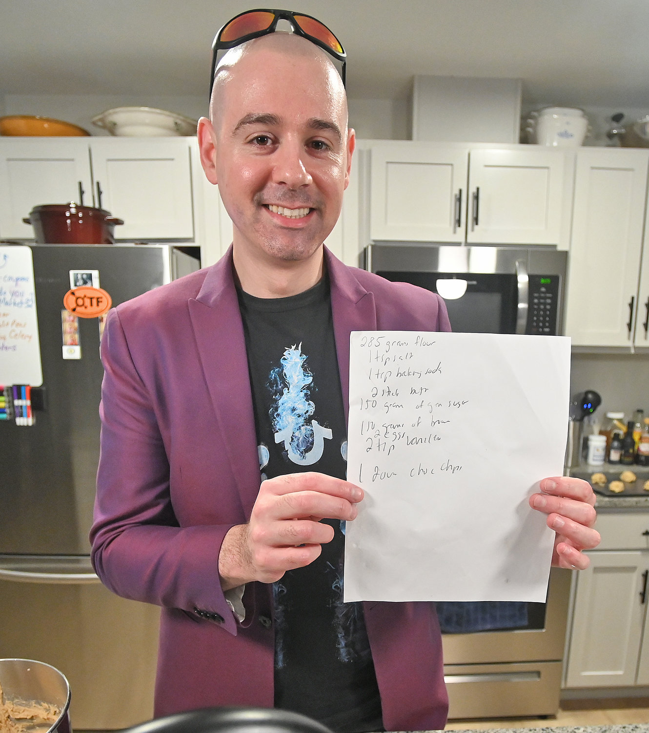 James Daino proudly holds up his special but simple recipe for chocolate chip cookies Wednesday in Rome.