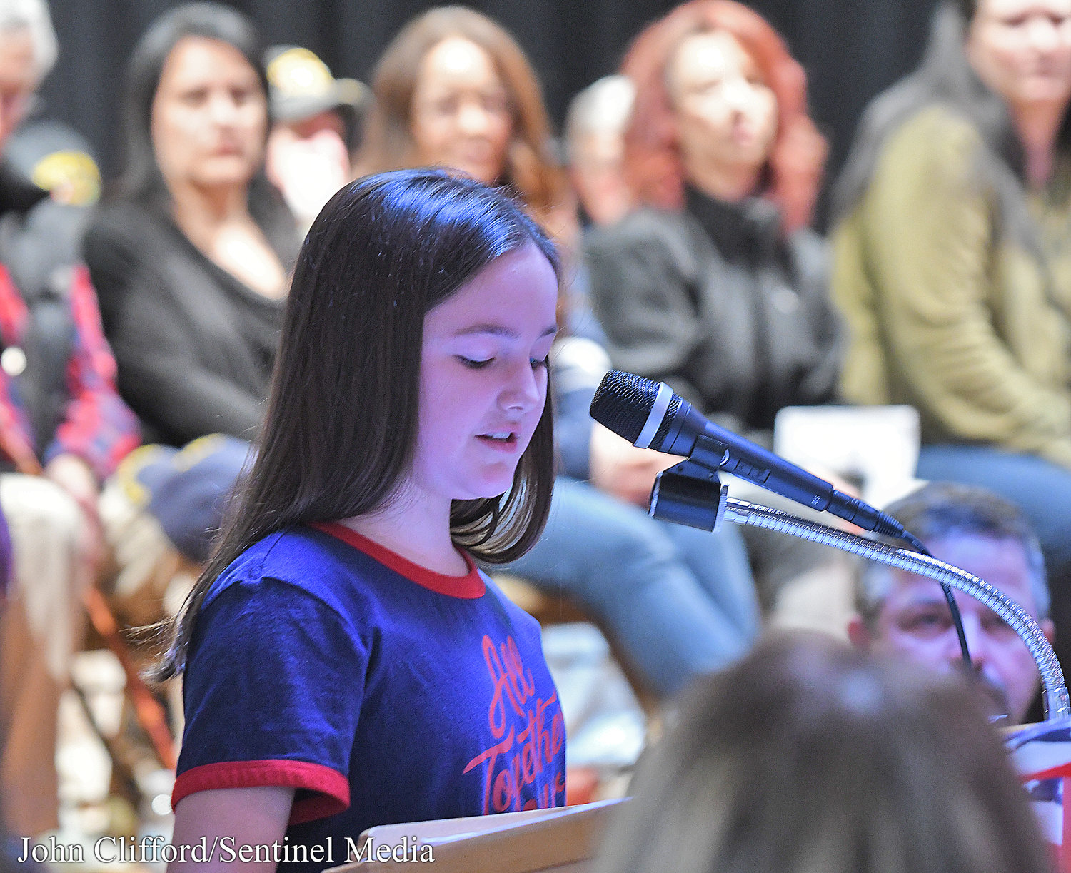Stokes Elementary School sixth grader  Allie Haggerty reads her remarks about the Army during a Veterans Day assembly, Thursday, November 10, 2022.