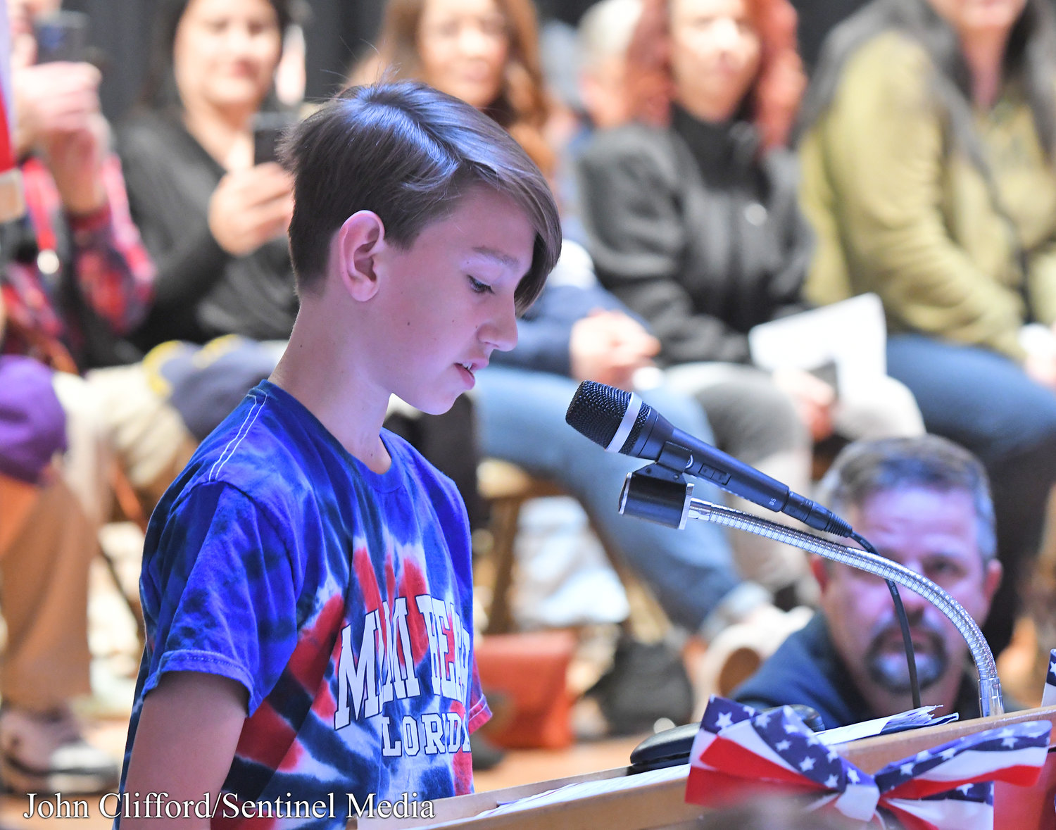 Stokes Elementary School sixth grader  Cruz Bouton reads his remarks about the Marine Corps during a Veterans Day assembly, Thursday, November 10, 2022.