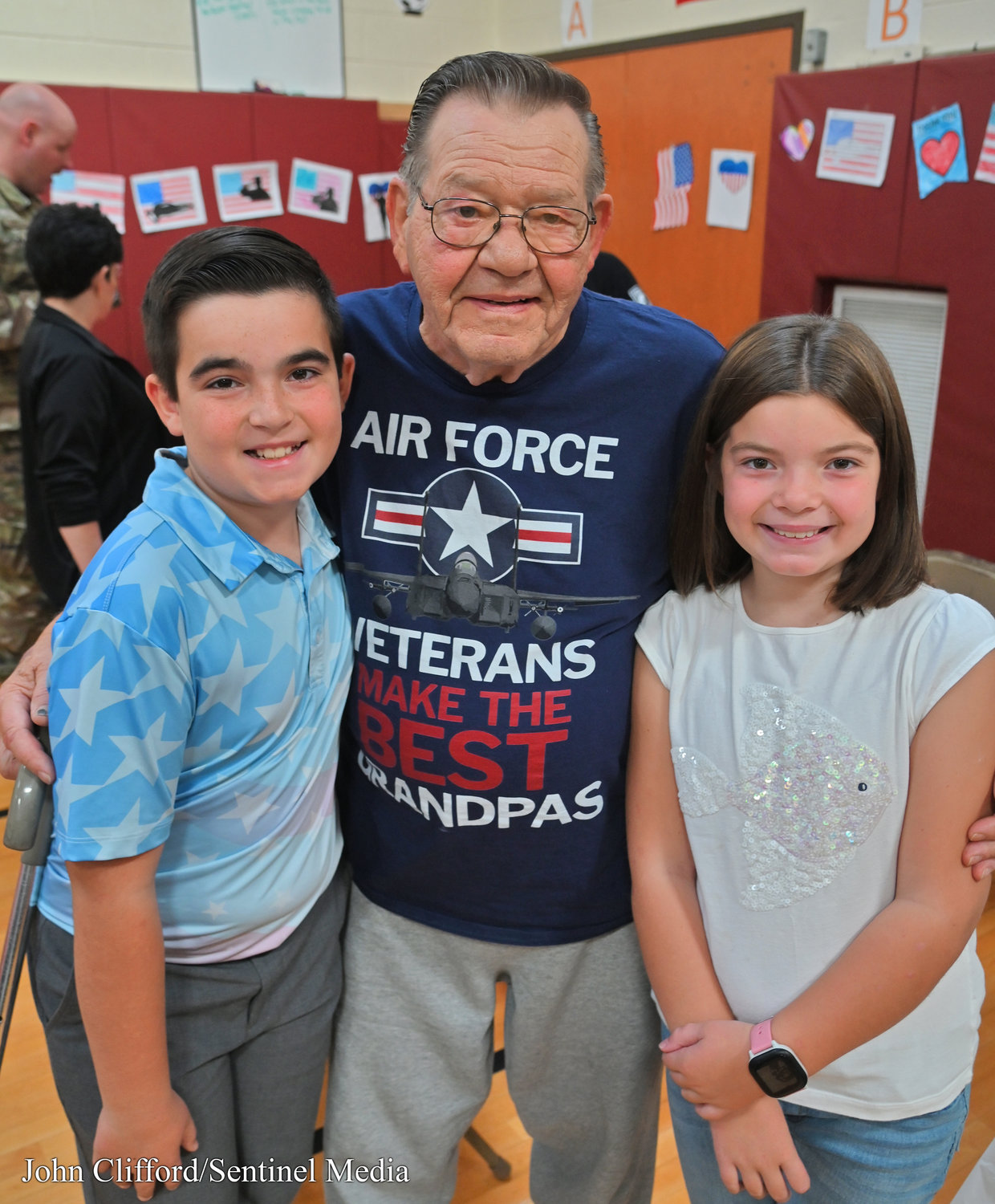 Air Force veteran Richard Johnson with his grandchildren Richard Johnson- 6th grader and Addie Johnson- 3rd grader-  after the Veterans Day Ceremony at Stokes Elementary School Thursday, November 10, 2022.