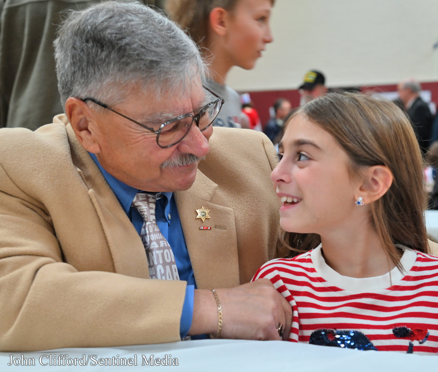 Enrico D'Alessandro with his granddaughter Antonia D'Alessandro during a get together after the Veterans Day ceremony at Stokes Elementary School Thursday, November 10, 2022.