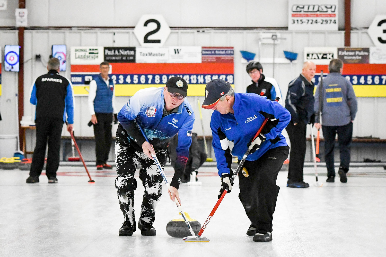 2022 ROSS TARLTON COMPETITION — Roger Rowlett and Conrad Law with the Utica 2 team compete in the 53rd annual Ross Tarlton International Bonspiel on Friday afternoon at the Utica Curling Club in Whitesboro. The Utica Curling Club is hosting the event through today at the facility at 8300 Clark Mills Road. It’s an invitational men’s competition pitting teams from clubs in the Ontario Curling Association (OCA) with those from the Grand National Curling Club (GNCC). The competition is a 32-team event (16 from the GNCC and 16 from the OCA), and the winning side is determined by the aggregate number of stones won after each team plays all four (8-end) games.