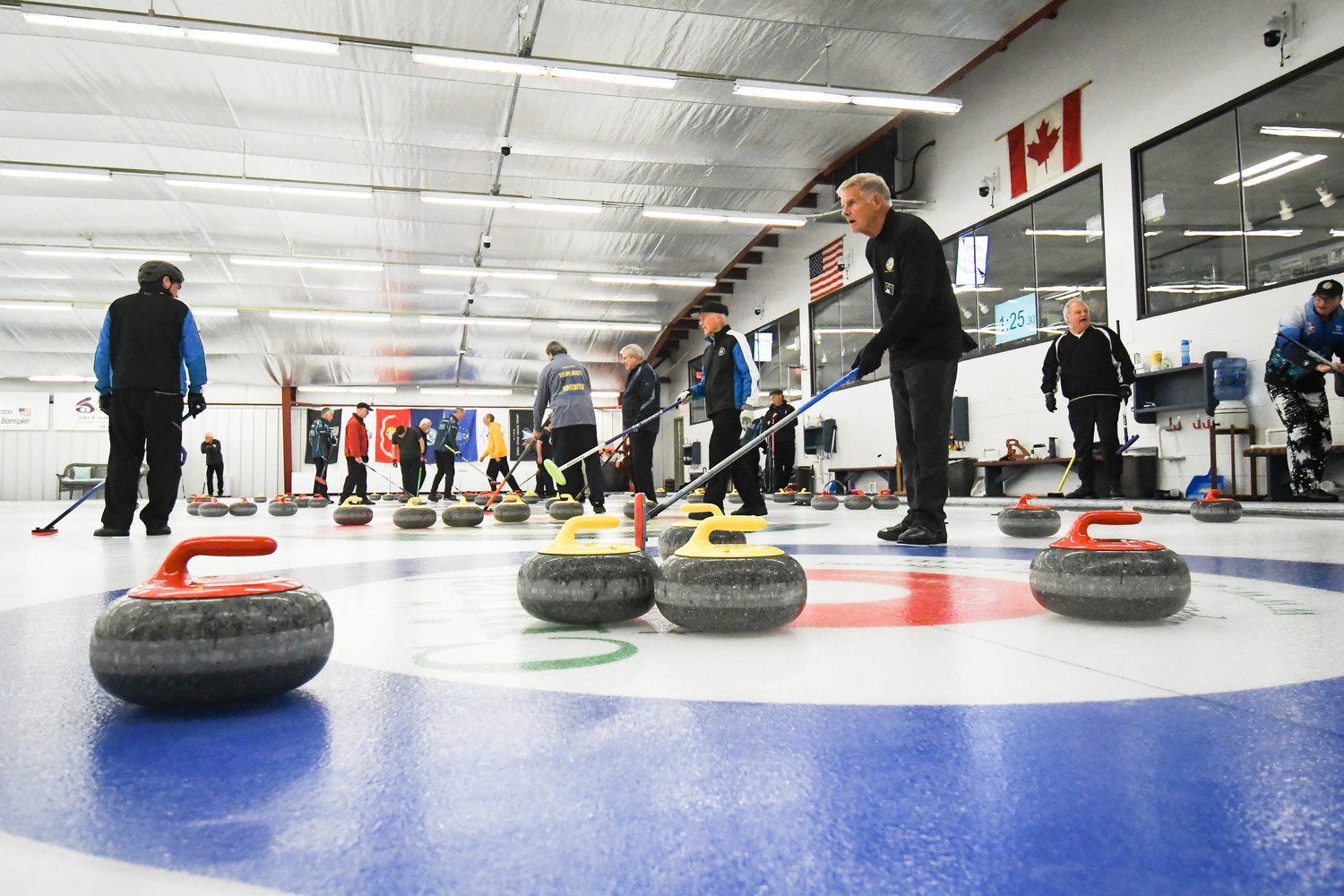 Teams compete in the 53rd annual Ross Tarlton International Bonspiel on Friday afternoon at the Utica Curling Club in Whitesboro.