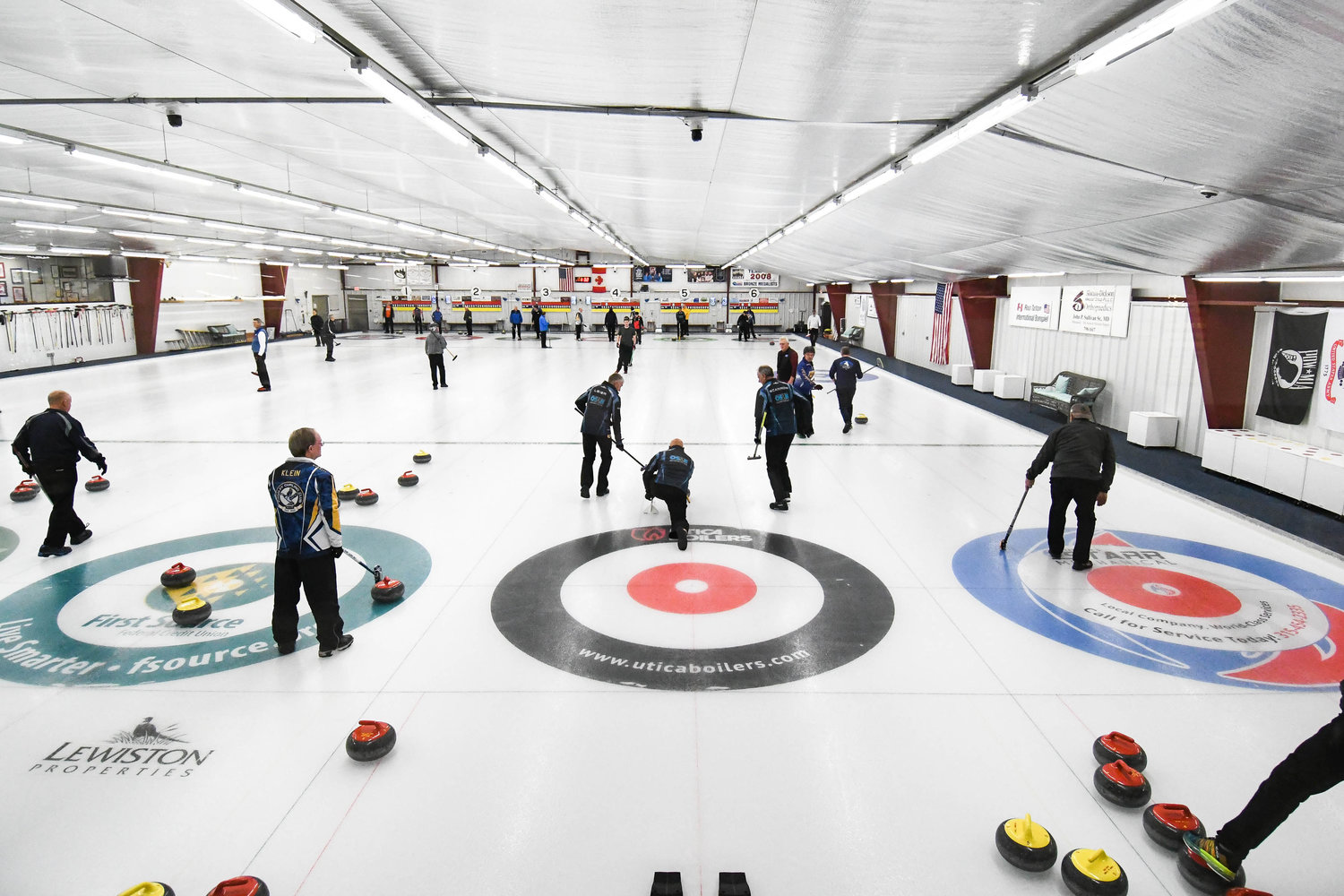 Teams compete in the 53rd annual Ross Tarlton International Bonspiel on Friday afternoon at the Utica Curling Club in Whitesboro.
