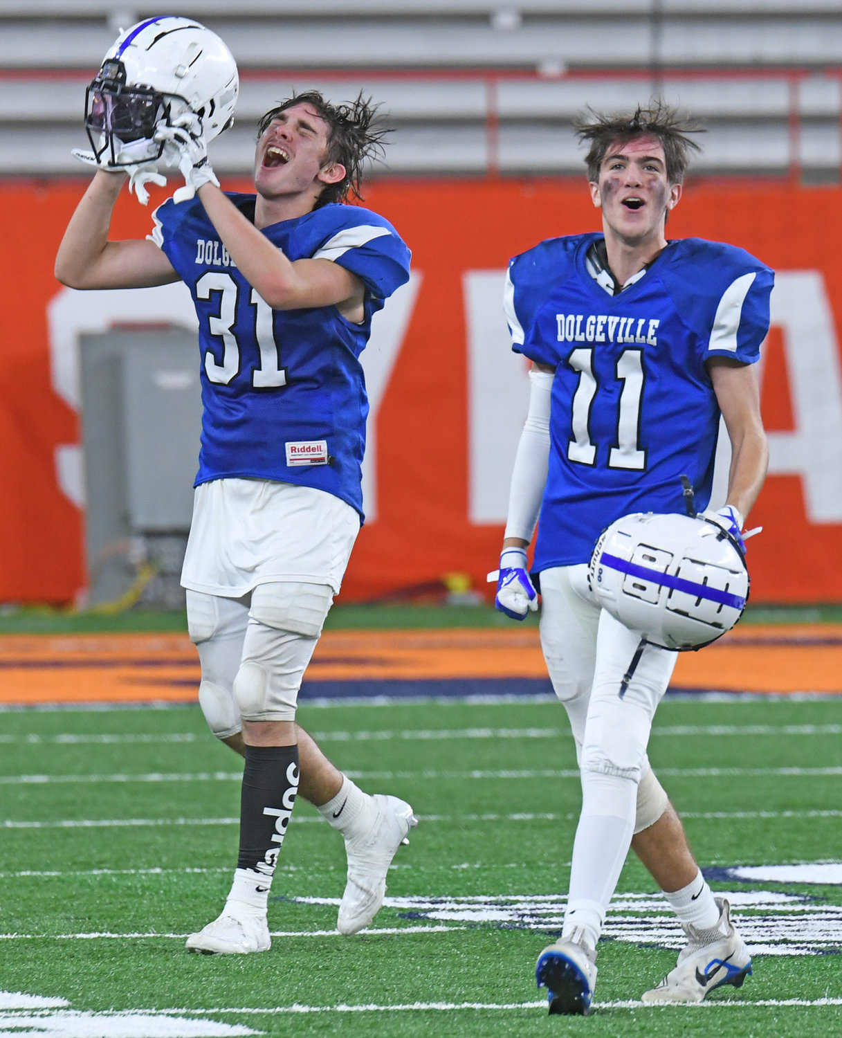 Dolgeville's Michael Blaskey, left, and TJ Rankins whoop it up after the final seconds tick away in the Section III Class D win over Beaver River in the championship at the JMA Wireless Dome in Syracuse.