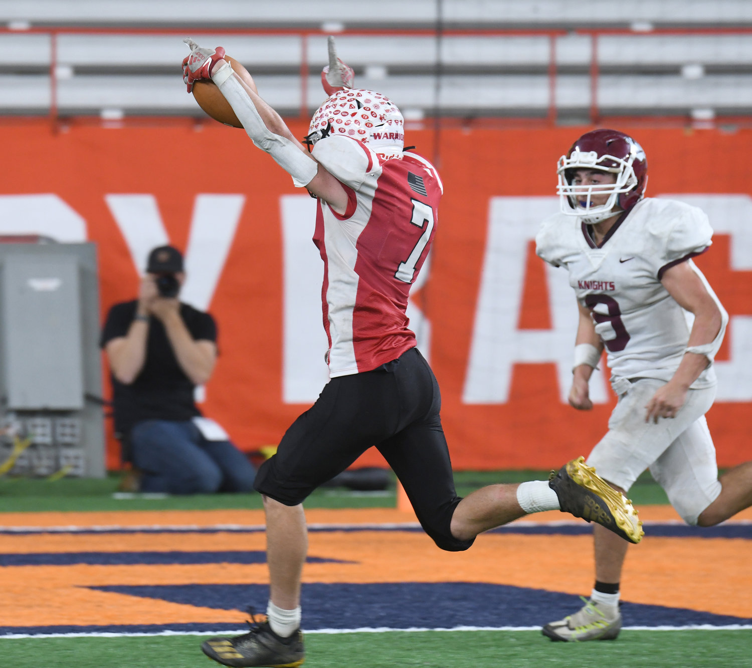 Morrisville-Eaton’s James Dapson III scores the winning TD ahead of Frankfort-Schuyler’s Martino Rocco in the Section III 8-man game at the JMA Wirelsss Dome in Syracuse. Morrisville-Eaton claimed its first Section III title.