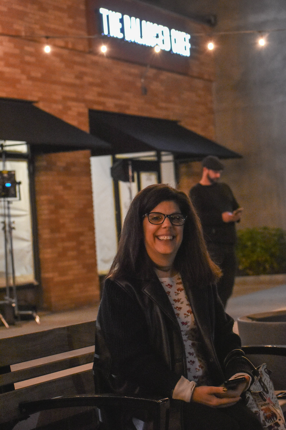 Food Network and Robert Irvine fan Jeanna Simonette patiently waits outside The Balanced Chef as production of Irvine's T.V. show "Restaurant: Impossible" takes place.