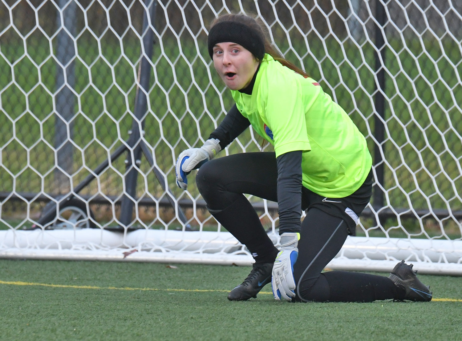 New Hartford goalkeeper Savannah Cole reacts to making the save in the penalty kick round  Saturday afternoon at Tompkins Cortland Community College. New Hartford advances to the state Class A championship game at 10:30 a.m. Sunday at the same field.
