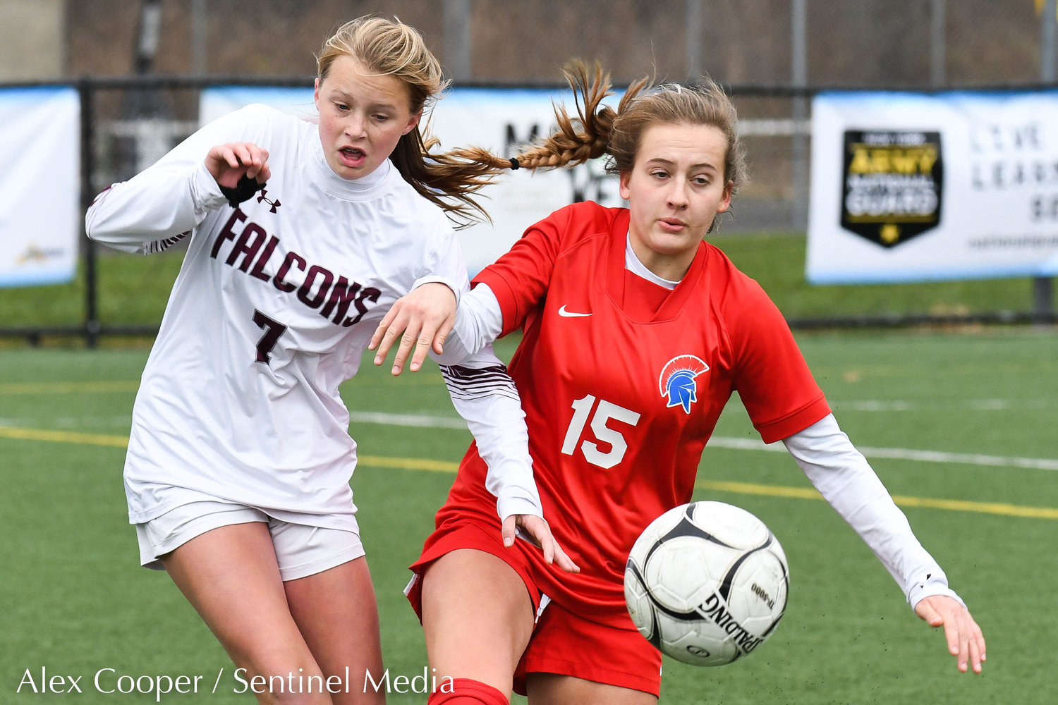 New Hartford player Anna Rayhill (15) fights for control of the ball with Albertus Magnus player Teigan Cunnane (7) during the Class A state final on Sunday at Tompkins-Cortland Community College. The Spartans lost 3-1.