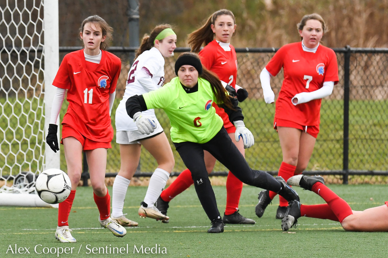 New Hartford goalie Savannah Cole and teammates watch the ball after a shot is blocked during the Class A state final on Sunday at Tompkins-Cortland Community College. The Spartans lost 3-1.
