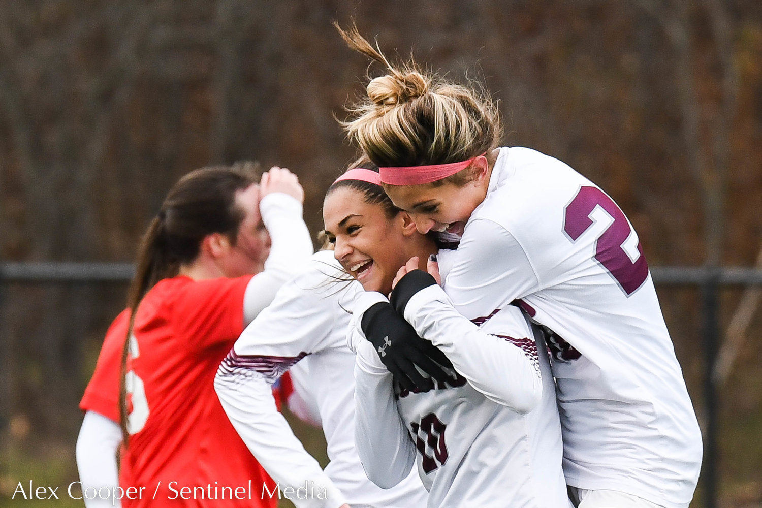 Albertus Magnus players celebrate after scoring a goal in the Class A state final against New Hartford on Sunday at Tompkins-Cortland Community College.