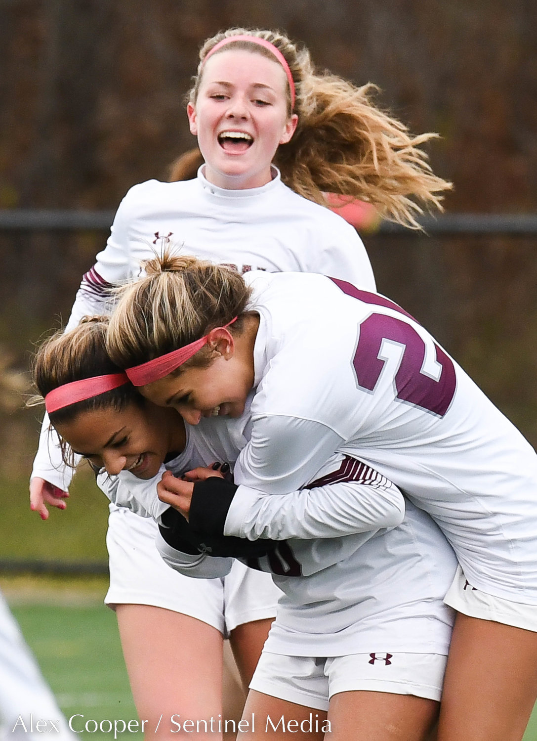 Albertus Magnus players celebrate after scoring a goal in the Class A state final against New Hartford on Sunday at Tompkins-Cortland Community College.