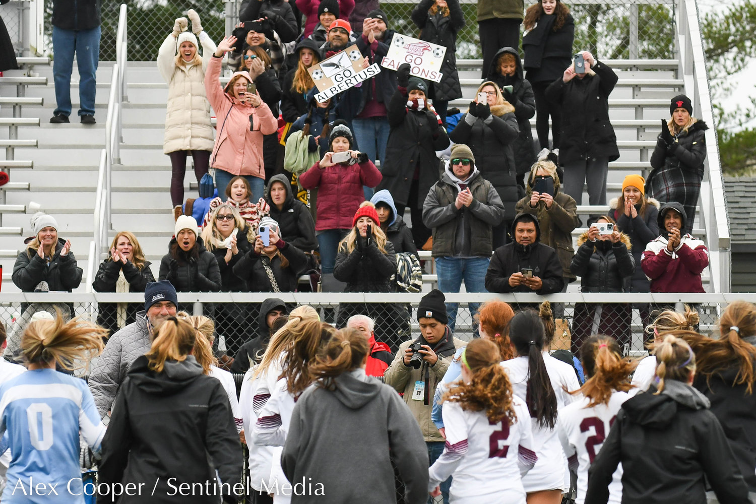 Albertus Magnus fans cheer after their team beat New Hartford 3-1 in the Class A state final on Sunday at Tompkins-Cortland Community College.