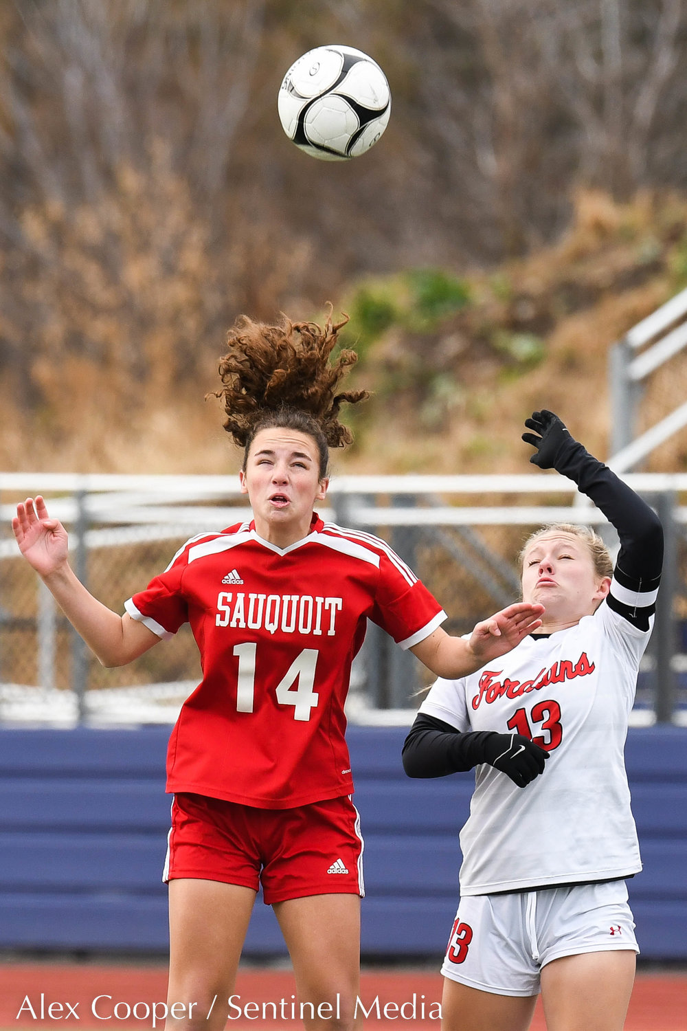 Sauquoit Valley player Ella Dischiavo (14) heads the ball as Waterford-Halfmoon player Addyson Galuski (13) defends during the Class C state final on Sunday at Cortland High School. The Indians lost 6-3.