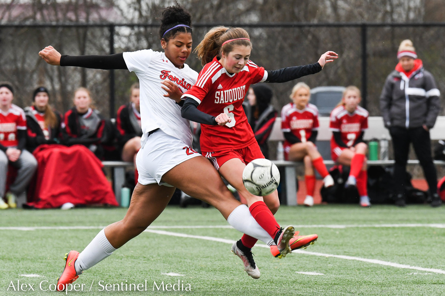 Sauquoit Valley player Kaitlyn Corr fights for control of the ball with a Waterford-Halfmoon player during the Class C state final on Sunday at Cortland High School. The Indians lost 6-3.