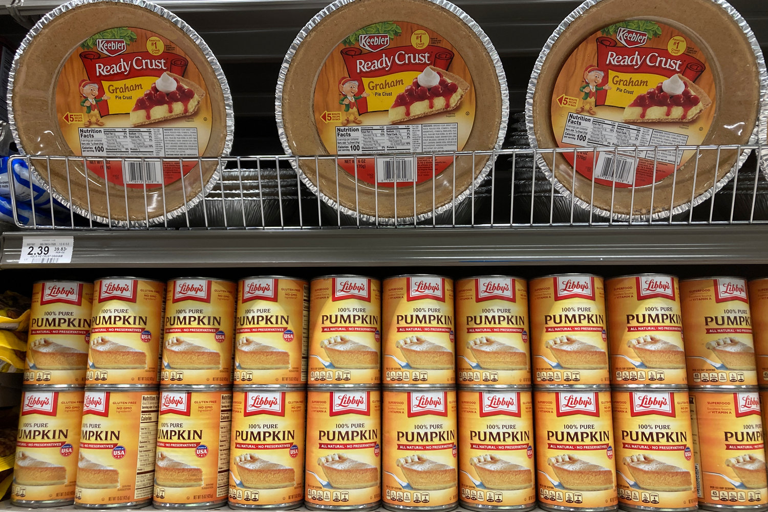File - Canned pumpkin and graham cracker shell crusts are displayed at a Publix Supermarket, Tuesday, Nov. 16, 2021 in North Miami, Fla. Americans are bracing for a costly Thanksgiving this year, with double-digit percent increases in the price of turkey, potatoes, stuffing, canned pumpkin and other staples. (AP Photo/Marta Lavandier, File)