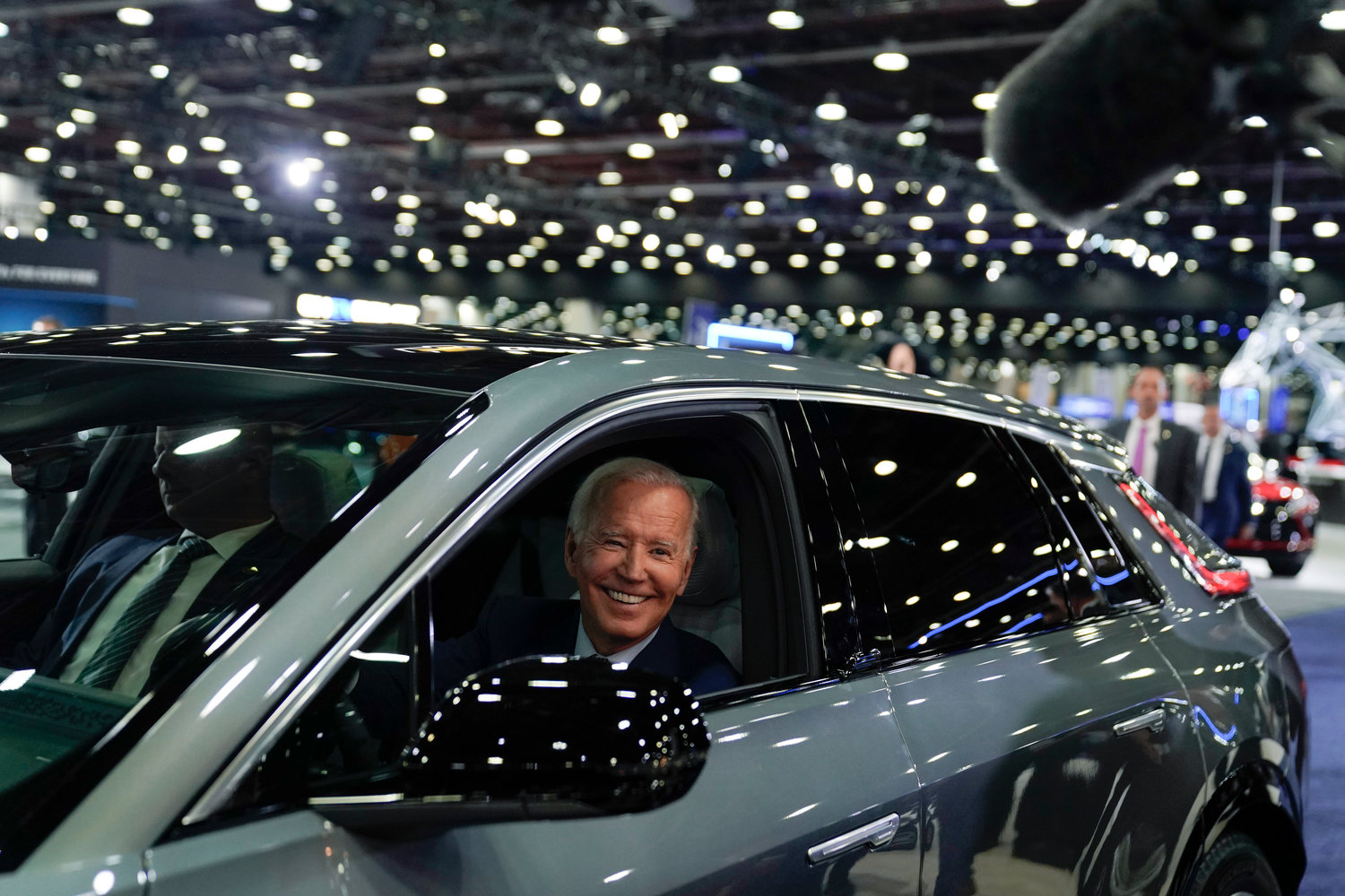 President Joe Biden drives a Cadillac Lyriq through the showroom during a tour at the Detroit Auto Show, Sept. 14, 2022, in Detroit. Biden turns 80 on Sunday, Nov. 20.