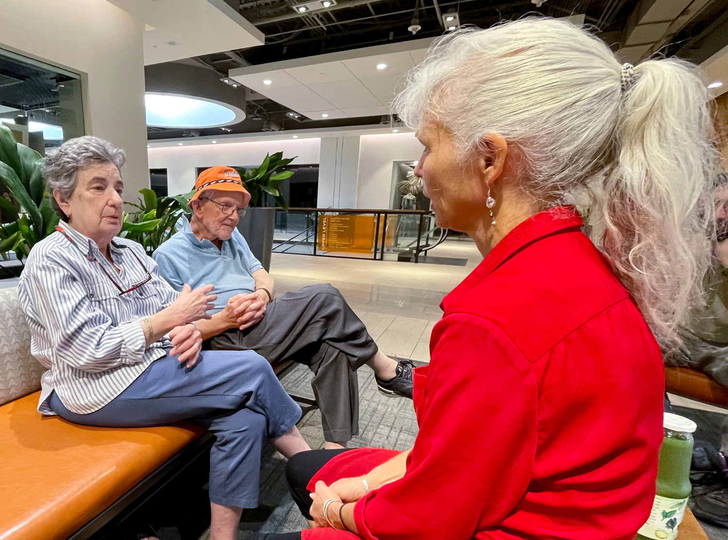 Roz and Nelson Hyman, left, talk with their friend Elizabeth Grove at a shopping complex in Towson, Md., Sept. 18, 2022. The Hymans are Democrats who say President Joe Biden's age, 80 on Sunday, isn't a concern for them if he decides to run for another term. The oldest president in U.S. history has a record as a campaign winner and has posted major legislative successes in recent months. But surveys of voters point to concern about his capabilities.