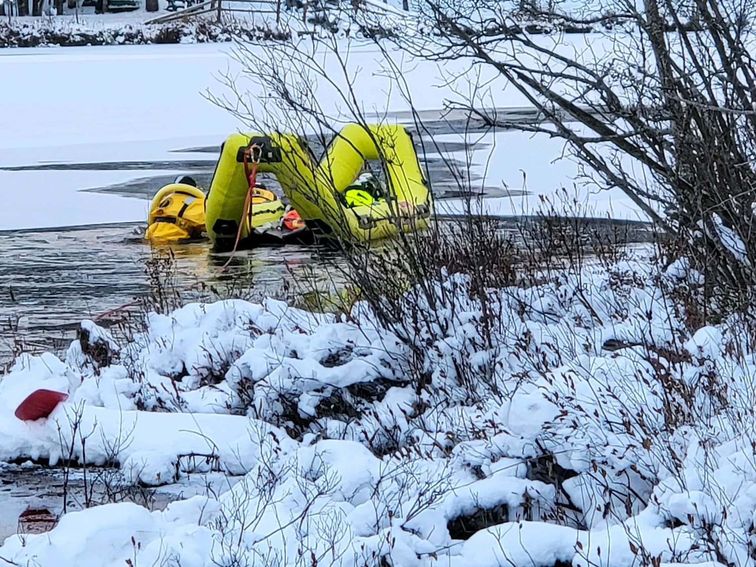 The Trenton ice water rescue team used an inflatable raft and dry suits to rescue a Labrador Retriever from Snowbird Lake in Forestport on Saturday.