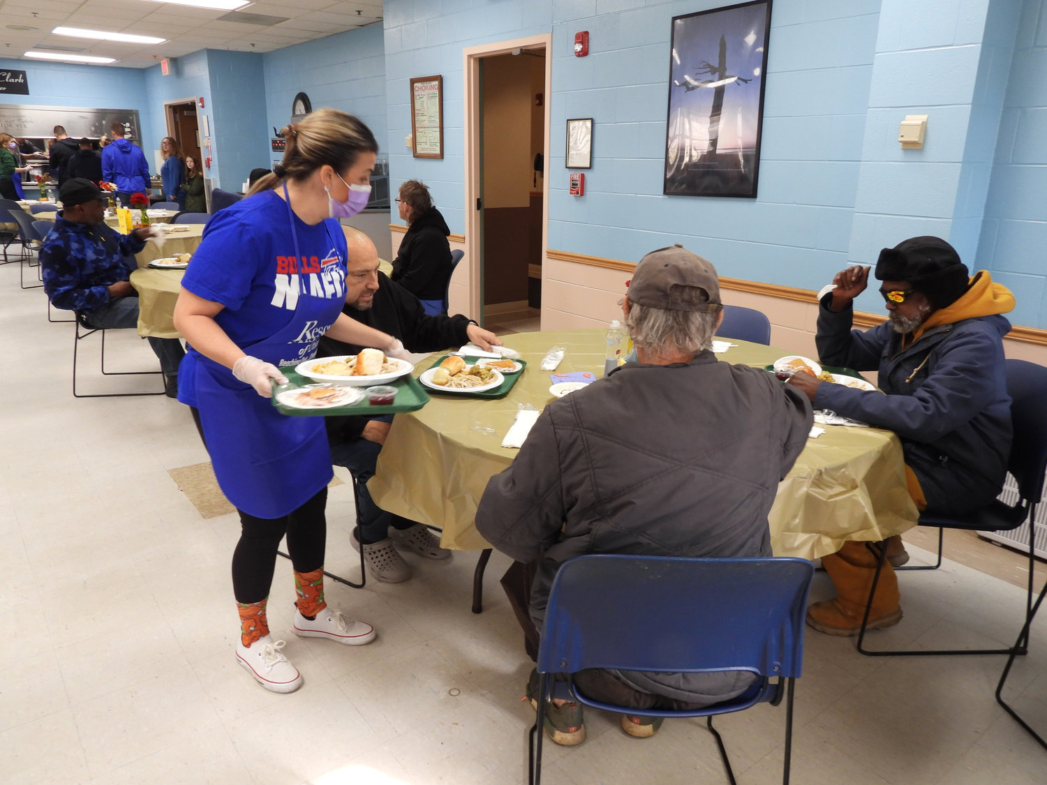 The Rescue Mission is devoted to feeding the community whenever they can, but Thanksgiving is a time when everyone should be able to sit down with friends and family for a holiday meal. Pictured is the Utica Rescue Mission, handing out plates for their Thanksgiving Luncheon