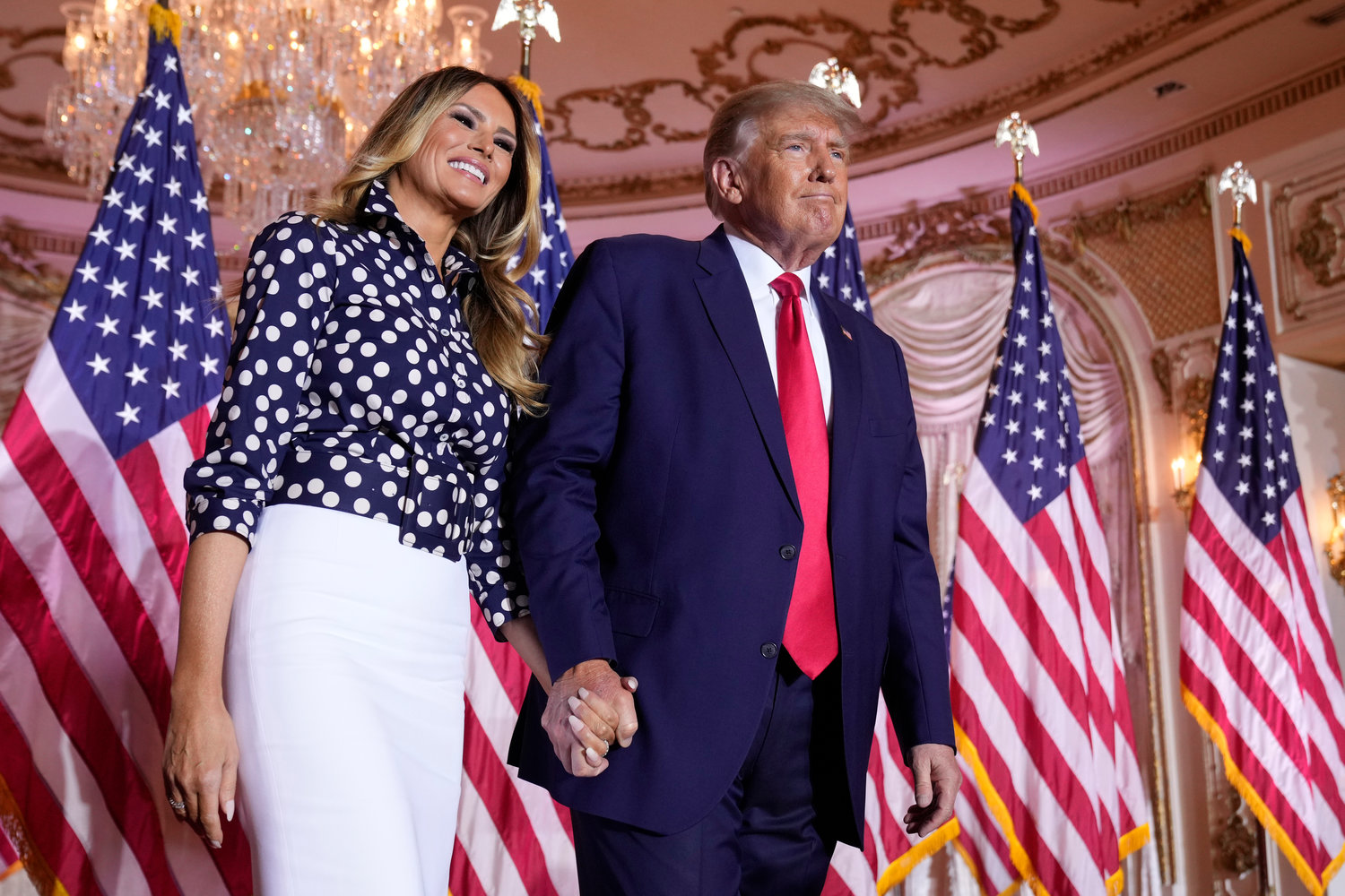 Former President Donald Trump stands on stage with former first lady Melania Trump after he announced a run for president for the third time at Mar-a-Lago in Palm Beach, Fla., Nov. 15, 2022. Trump has spent years teasing the prospect of another presidential run. But in the first week since announcing his third bid for the White House, he's done little to suggest that he's organizing a traditional campaign. (AP Photo/Andrew Harnik, File)