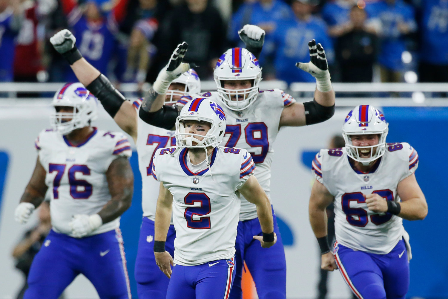 Teammates react after Buffalo Bills place kicker Tyler Bass (2) kicked a 45-yard game winning field goal in the closing seconds of a game against the Detroit Lions on Thursday afternoon in Detroit. The Bills won 28-25.