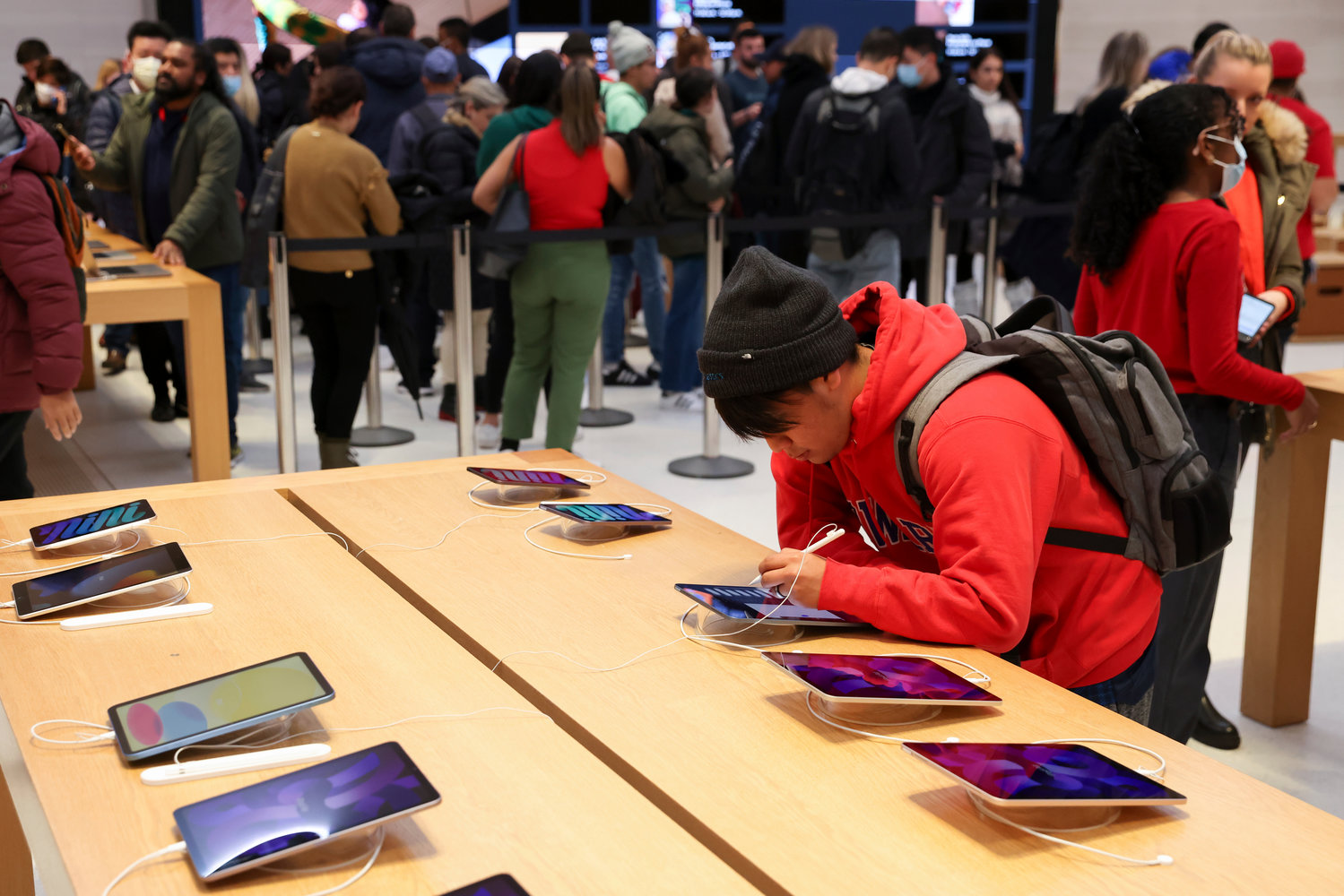 A person shops in an Apple store on Black Friday, Nov. 25, 2022, in New York.