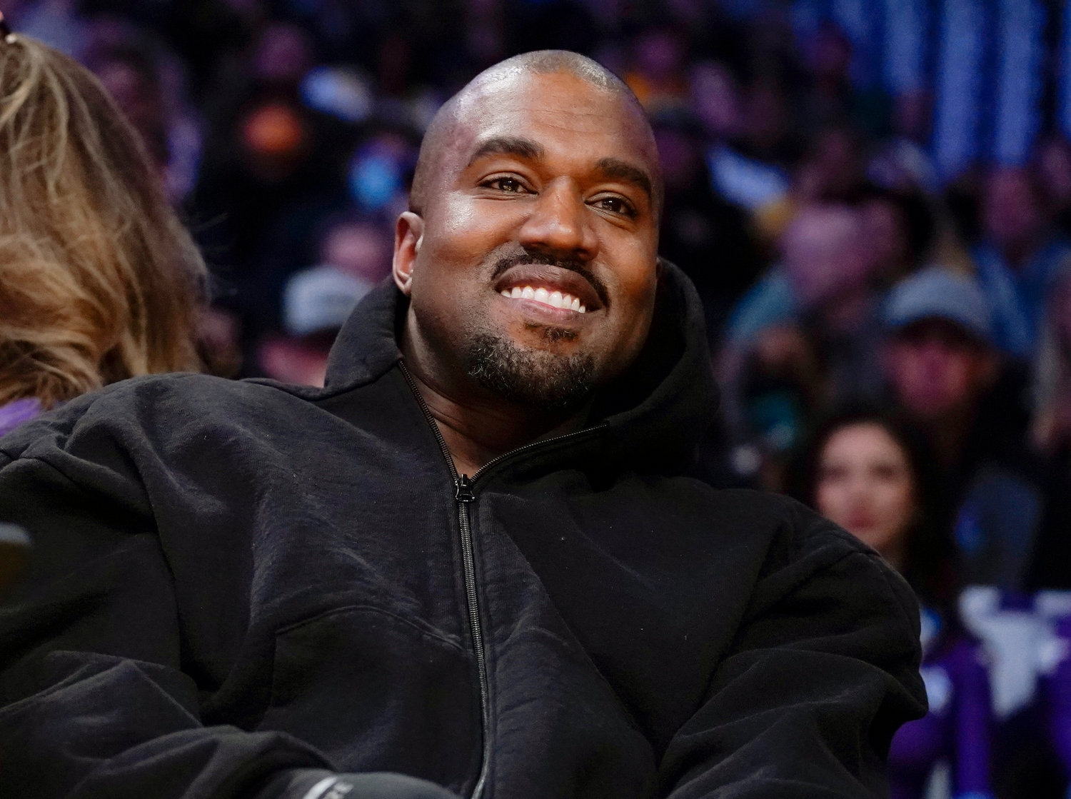 Kanye West watches the first half of an NBA basketball game between the Washington Wizards and the Los Angeles Lakers in Los Angeles, on March 11, 2022 Adidas says it is investigating allegations of inappropriate workplace conduct by the rapper formerly known as Kanye West that ex-employees made in an anonymous letter also accusing the German sportswear brand of looking the other way.