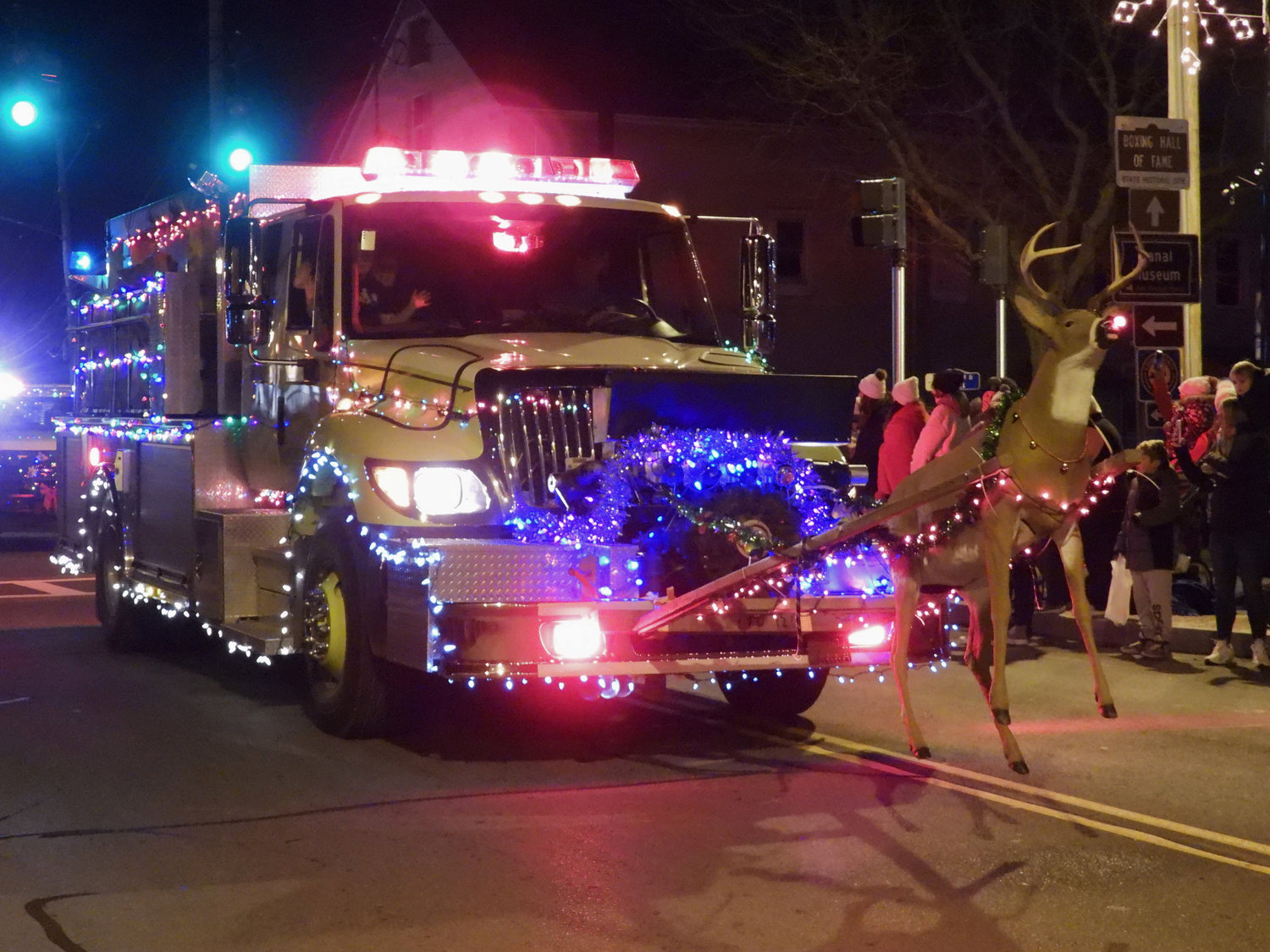 The Canastota Parade of Lights saw people fill the streets Saturday night to welcome in the holiday season. Organizations from Oneida to Syracuse were a part of the Parade. Pictured is the Canastota Fire Department's fire truck, strung with festive lights and guided by Rudolph the Red-Nosed Reindeer.