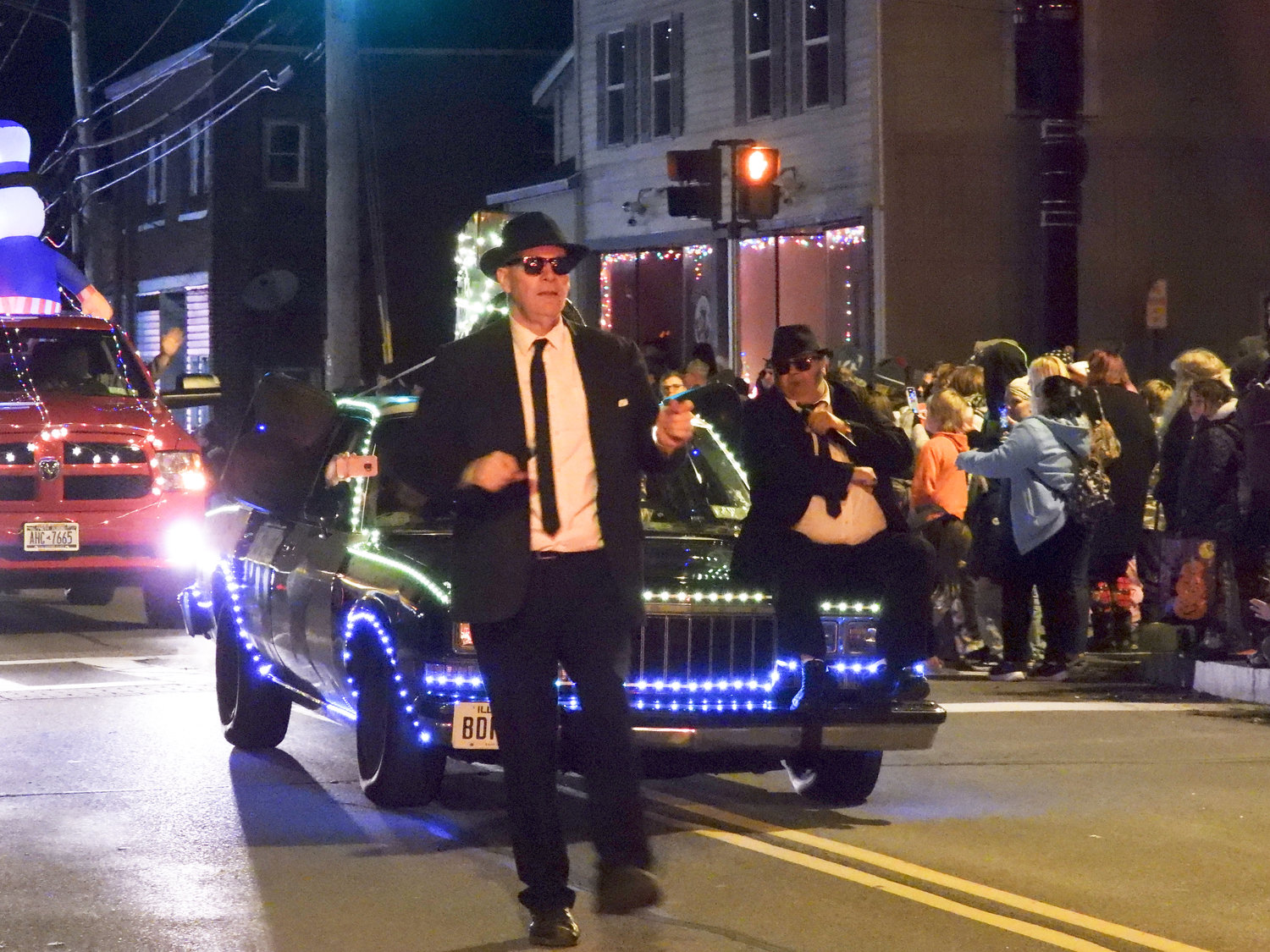 The Canastota Parade of Lights saw people fill the streets Saturday night to welcome in the holiday season. Pictured are the Blues Brothers of Central New York.
