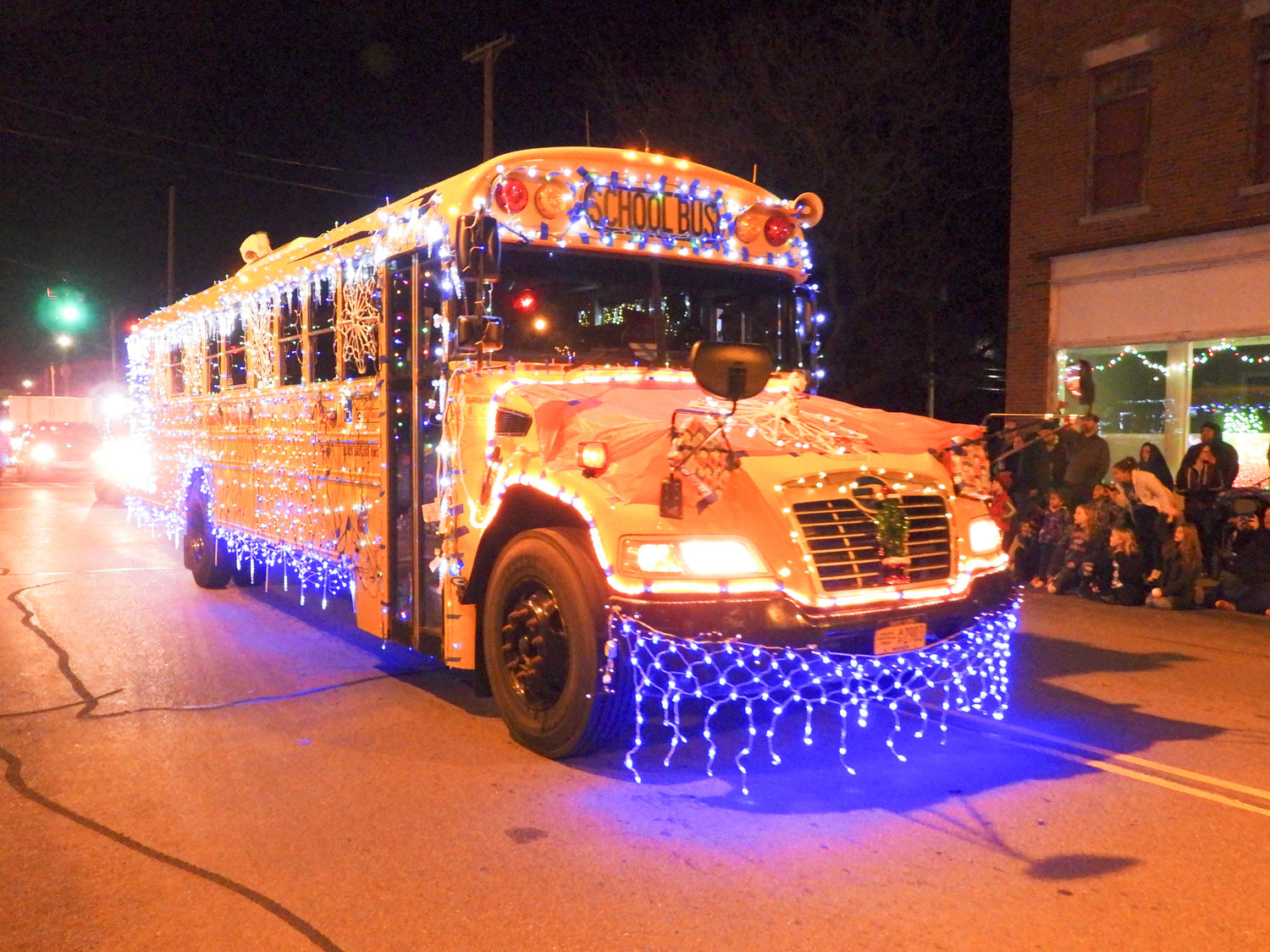 The Canastota Parade of Lights saw people fill the streets Saturday night to welcome in the holiday season. Pictured is Canastota Central School bus, all decorated for the holiday season.