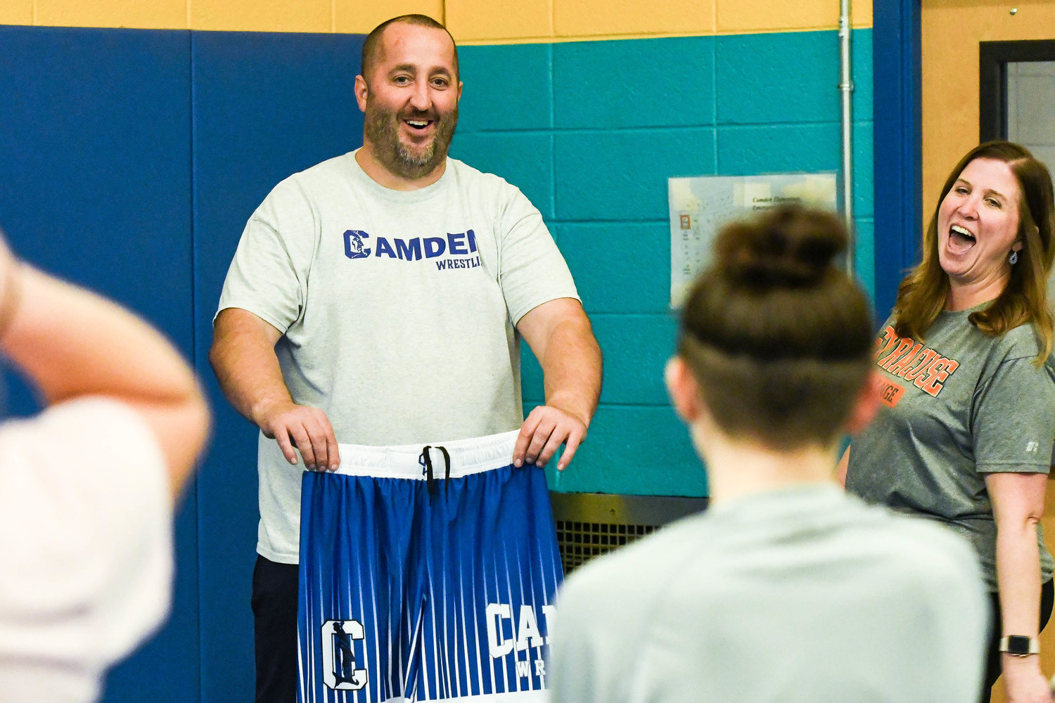 Camden head coach Jeremy Calkins and assistane coach Kara Norton reveal new uniforms during practice on Monday at Camden Elementary School.