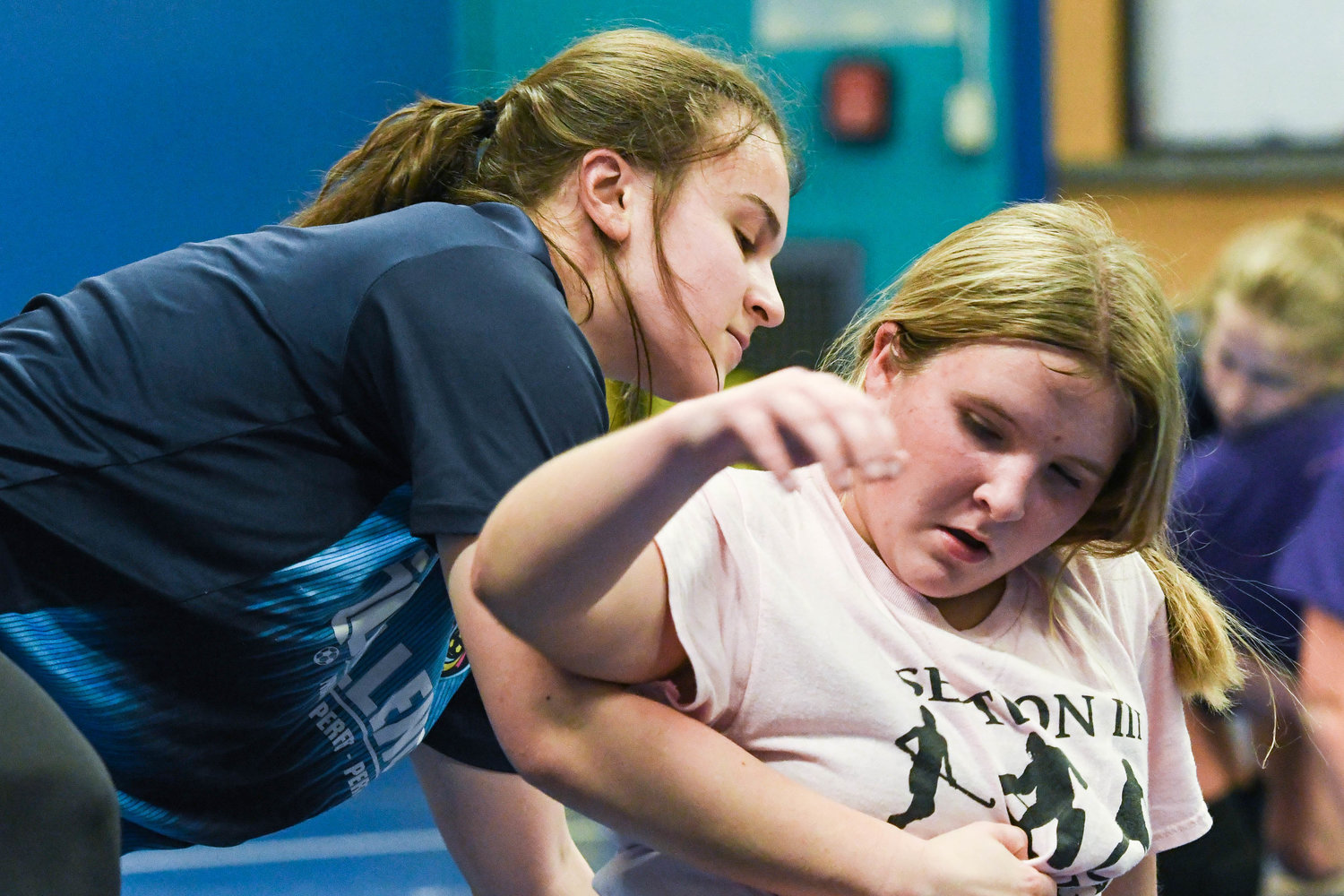 From left, Camden wrestler Wendy Kierpiec wrestles Abby Hebble during practice on Monday at Camden Elementary School.