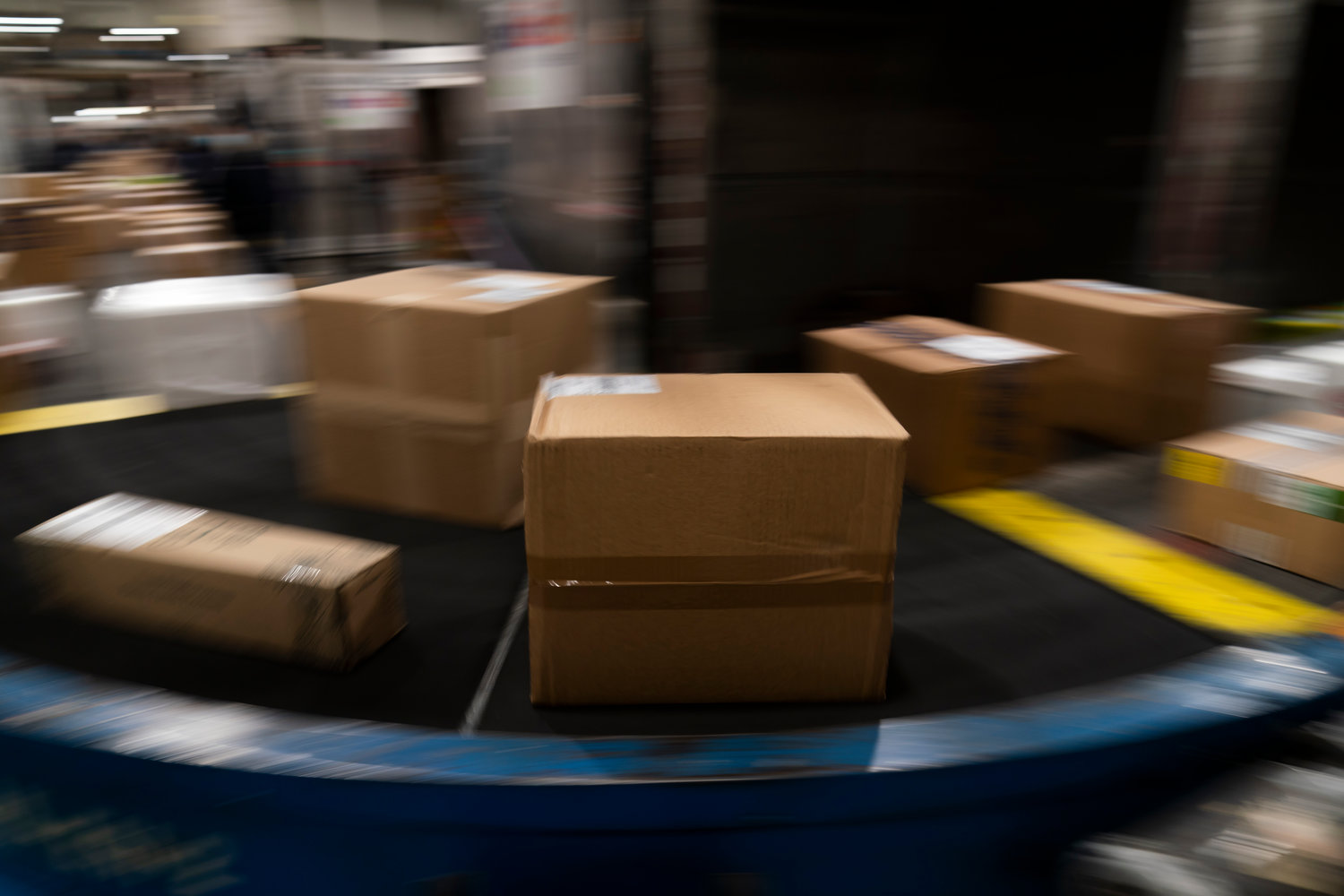 Packages move along a conveyor belt while being sorted for delivery at the FedEx regional hub at the Los Angeles International Airport in Los Angeles in this 2021 file photo.