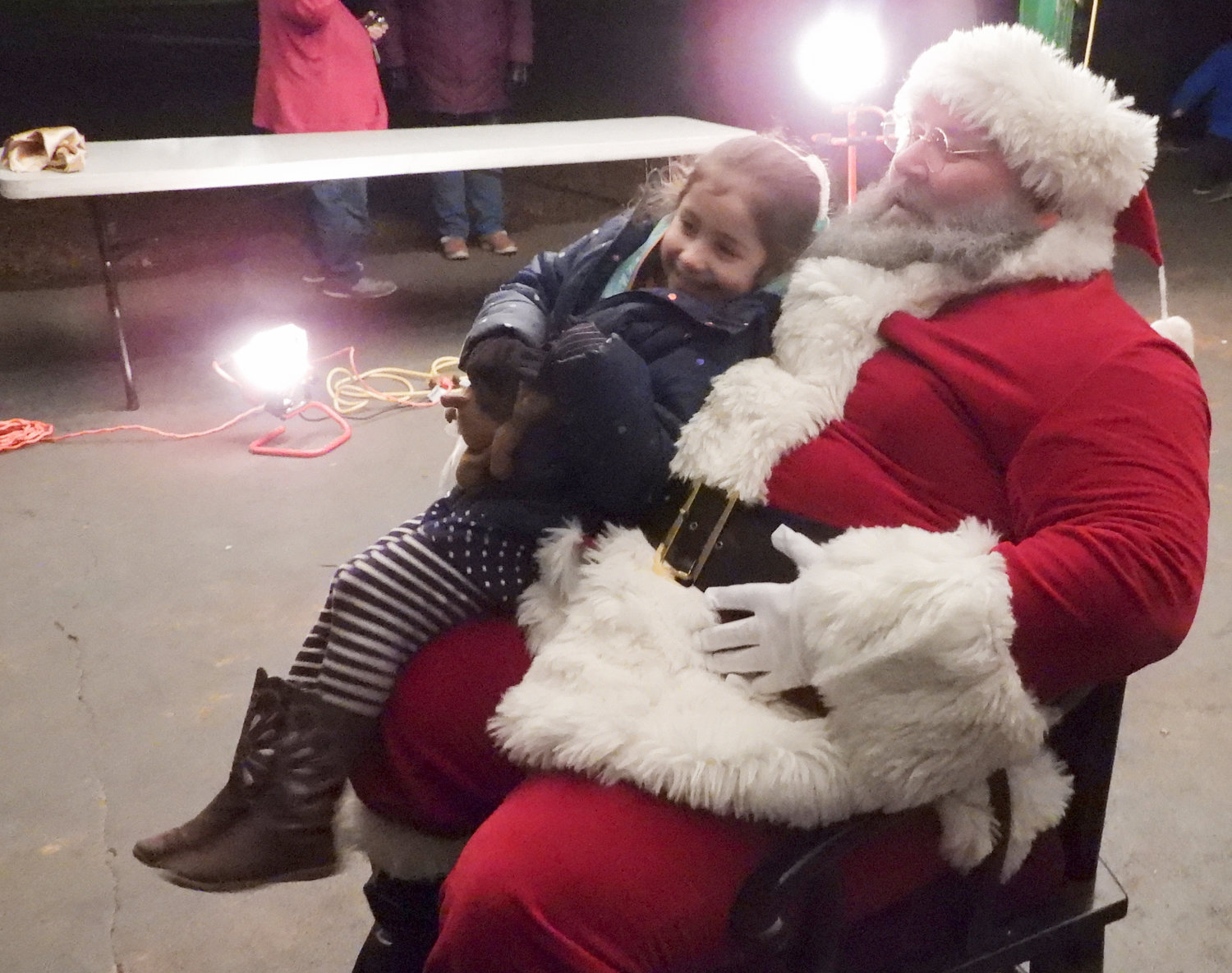 The city of Oneida welcomed in the holiday season with its second annual Parade of Lights, annual tree lighting, and a visit from Santa Claus. Pictured is Sophia Villavicencio, 4, from Oneida, sitting on Santa's lap.