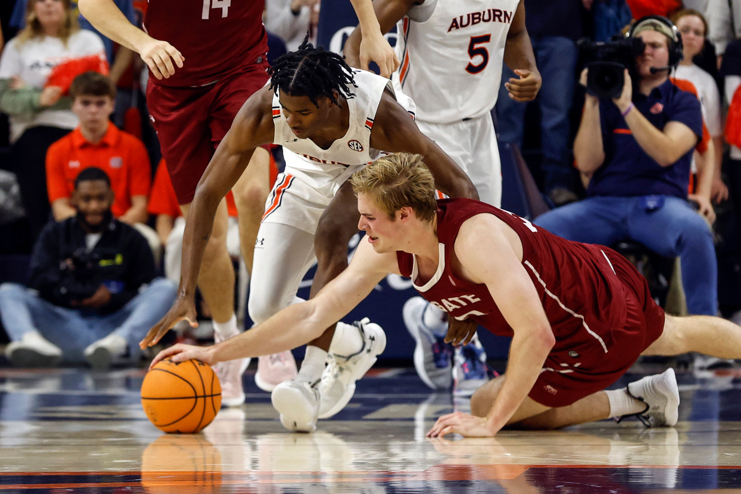 Auburn guard Chance Westry, left, and Colgate forward Sam Thomson, right, scramble for the ball during the first half of Friday night's game in Auburn, Ala. Auburn won 93-66.