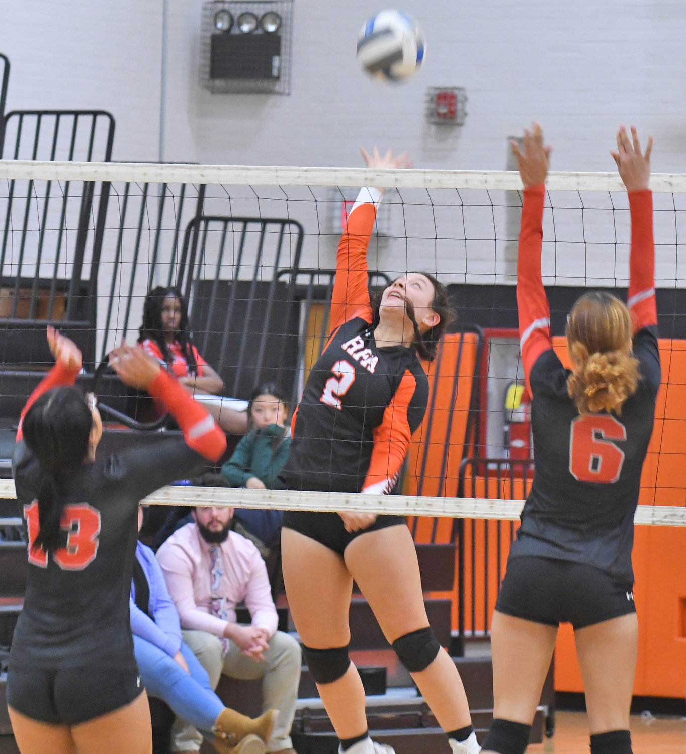 Alyce Frost (2) of Rome Free Academy prepares to spike the ball in action against Thomas R. Proctor High School at home Monday. Proctor’s Eh Ler Saw, left, and Elicia Barefoot are defending. RFA won in three straight sets. Frost had four kills, five digs and a pair of assists.