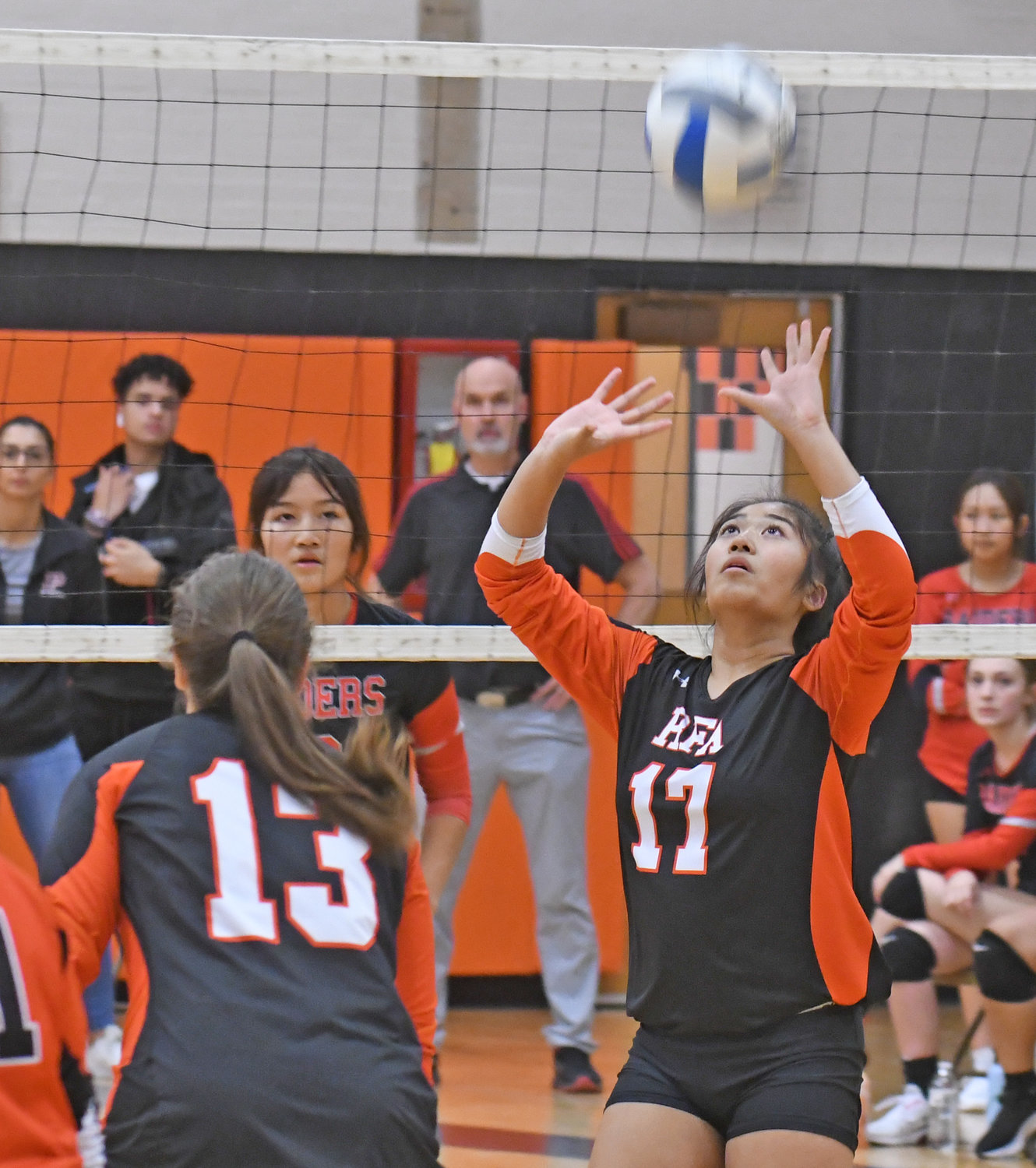 Rome Free Academy's Thylia Keoviengsamay (17) concentrates on the ball to set it for Miranda McCormick (13) Monday versus Thomas R. Proctor High School at Strough Junior High. The Black Knights won 3-0. Keoviengsamay had 19 assists.