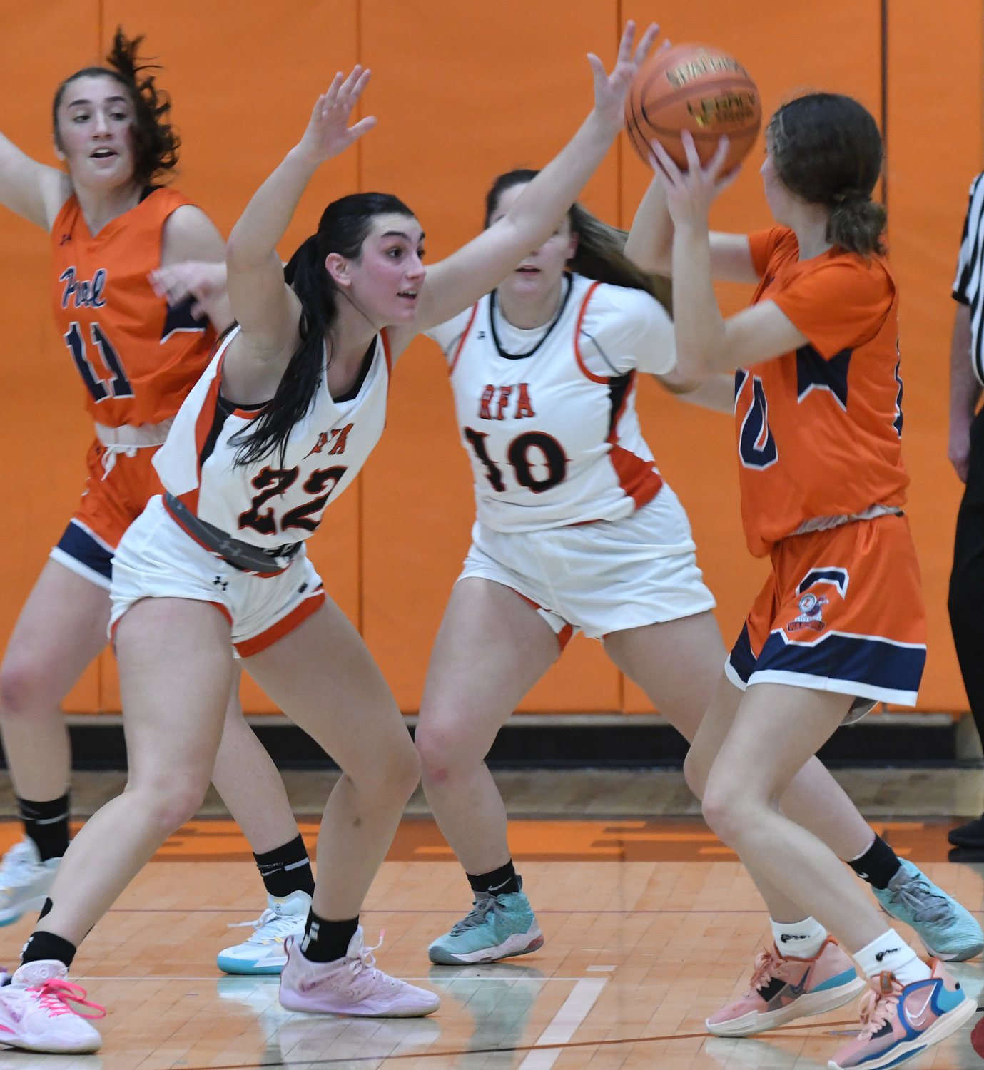 Rome Free Academy seniors Mia Mirabelli, left, and Raelyn Dole defend as Liverpool's Kaylyn Sweeney looks for a passing lane in the first half Tuesday night at RFA. RFA won 68-64 in overtime.
