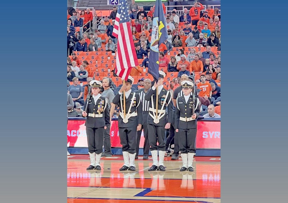 Notre Dame Navy Junior ROTC Cadets, from left, Marina Cascini, Isaiah Sexton, Shea Williams and Abigail Davis present the color guard at a recent Syracuse University basketball game at the JMA Wireless Dome in Syracuse.