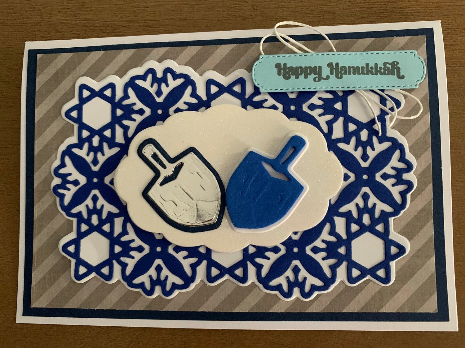 This image provided by Tiziana Fox shows a handmade Hanukkah card. Handmade holiday cards can be gifts in themselves for both maker and receiver. They're a way to express creativity and connection. And gathering to make them can be a nice social activity. (Tiziana Fox via AP)