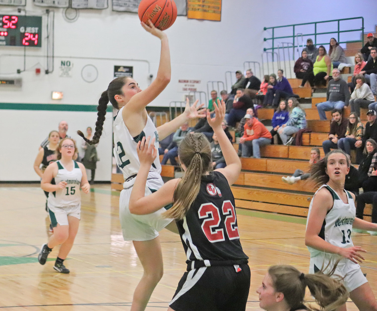 Westmoreland's Ella McGregor gets off a shot defended by Makayla Land of Sauquoit Valley Friday at home. McGregor scored six points in the team's 55-29 win.
