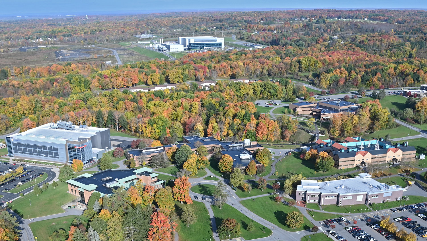 Pictured is an aerial of the SUNY Polytechnic Institute campus from Oct. 12, 2022. Danfoss Silicon Power (a silicon-carbide power module packaging operation at the Computer Chip Commercialization Center, better known as the Quad-C, on the SUNY Polytechnic campus) can be seen to the far left, and the under-construction Wolfspeed facility ( a silicon carbide computer chip fabricating facility in Marcy) can be seen in the far distance. In past years, stake holders noted one benefit of semiconductor industry facilities being seated close to one another are the  collaboration possibilities.